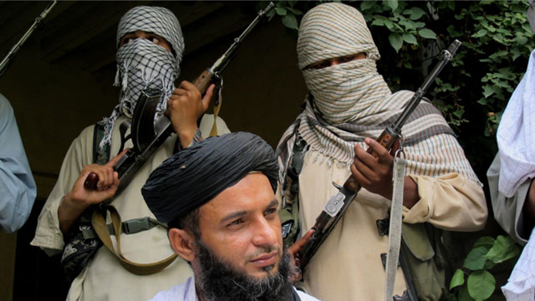 August 15, 2013: Asmatullah Muawiya, head of Tehrik-i-Taliban Pakistan Punjab, talks to media at an undisclosed place in Pakistani tribal region of Waziristan. Militants in Pakistan’s most populous province are said to be training for what they expect will be an ethnic-based civil war in neighboring Afghanistan after foreign forces withdraw. (AP Photo)