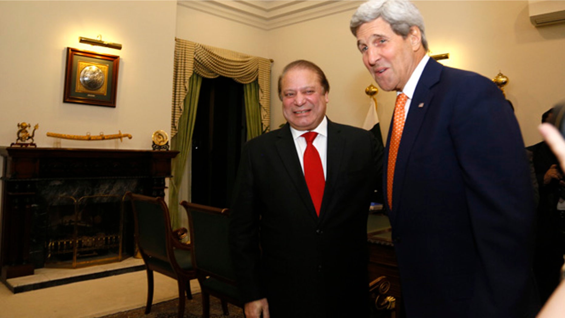 Jan. 12, 2015: U.S. Secretary of State John Kerry is greeted by Pakistan Prime Minister Nawaz Sharif shortly after arriving in Islamabad. (AP Photo/Rick Wilking, Pool)
