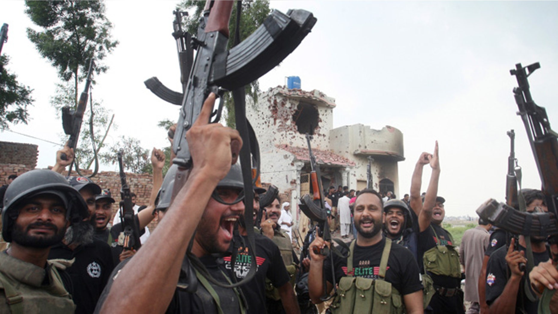 July 17, 2014: Pakistani police commandos celebrate a successful operation against terrorists in Lahore, Pakistan. (AP)
