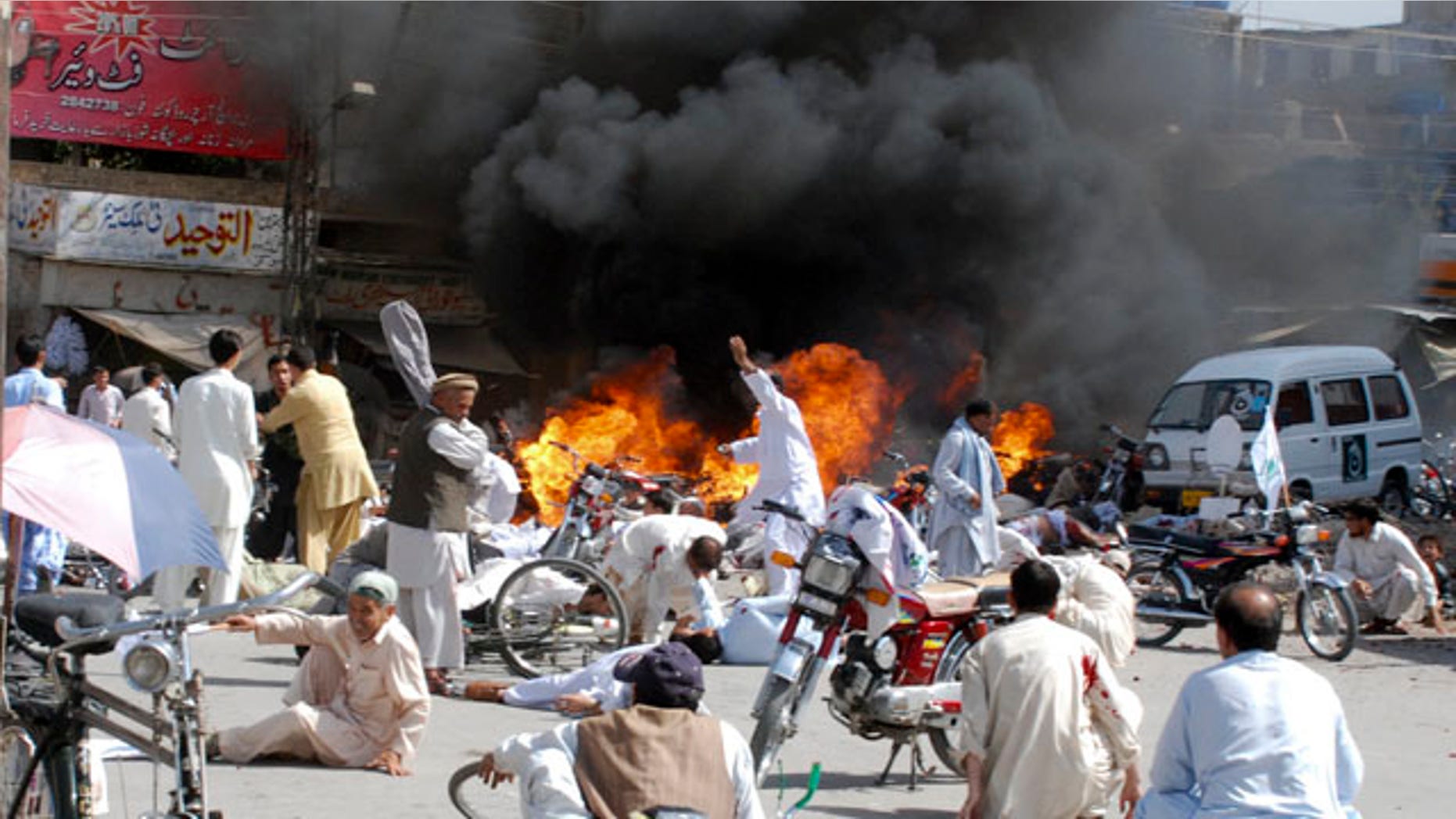 September 3: Injured people lie down on road after an explosion during a Shiite procession in Quetta, Pakistan. Police say a blast at a Shiite procession has killed many people in southwestern Pakistan in the third deadly attack this week on the country's religious minorities. (AP)