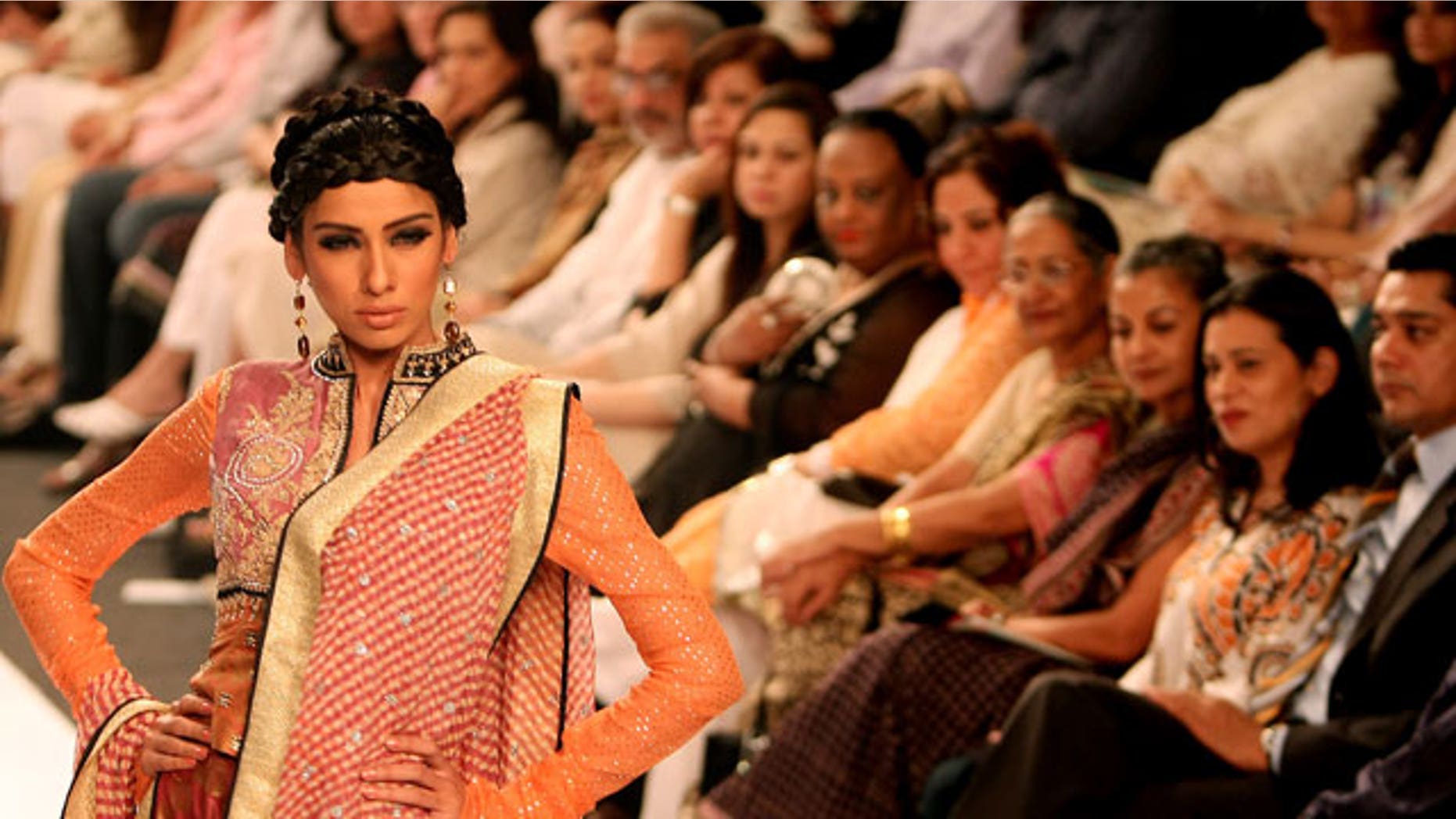 Nov. 7: A model displays a creation by Pakistani designer Faiza Samee during the Pakistan Fashion Week in Karachi, Pakistan.