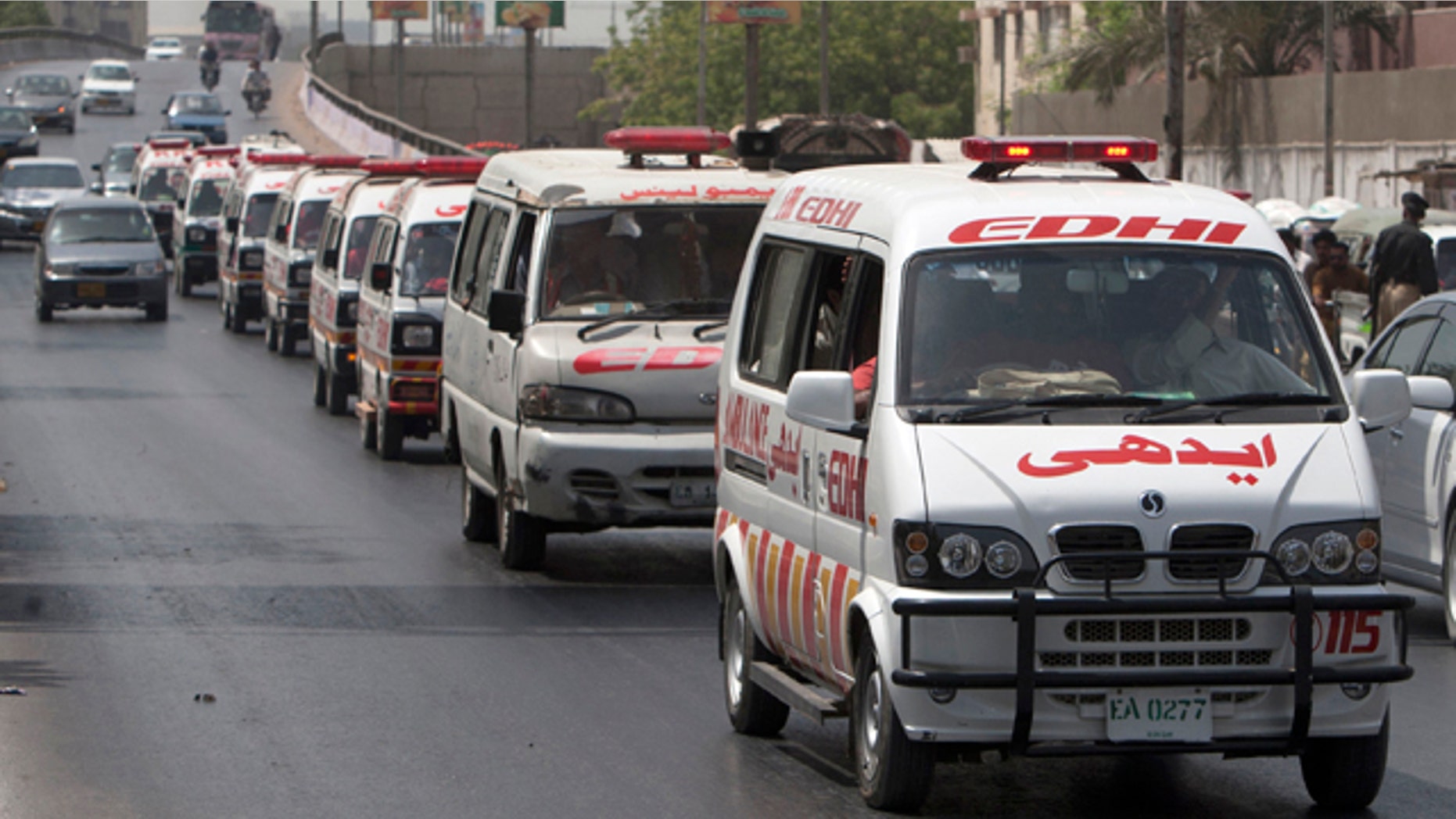 May 14, 2015: Ambulances carry bodies of Wednesday's bus attack victims for burial in Karachi, Pakistan. (AP Photo/Shakil Adil)