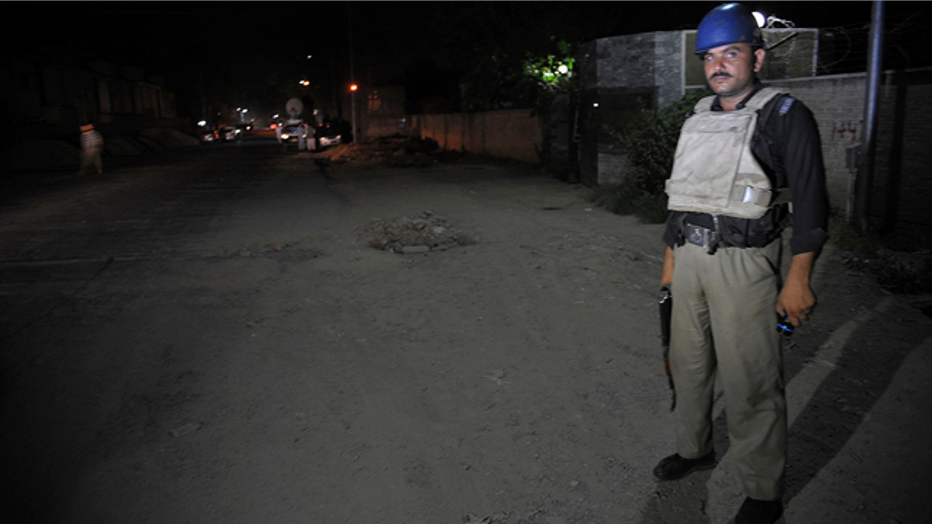 June 25, 2014: A Pakistani police officer stands guard near Peshawar airport which is cordon off, Wednesday, June 25, 2014 in Pakistan. (AP Photo/Mohammad Sajjad)