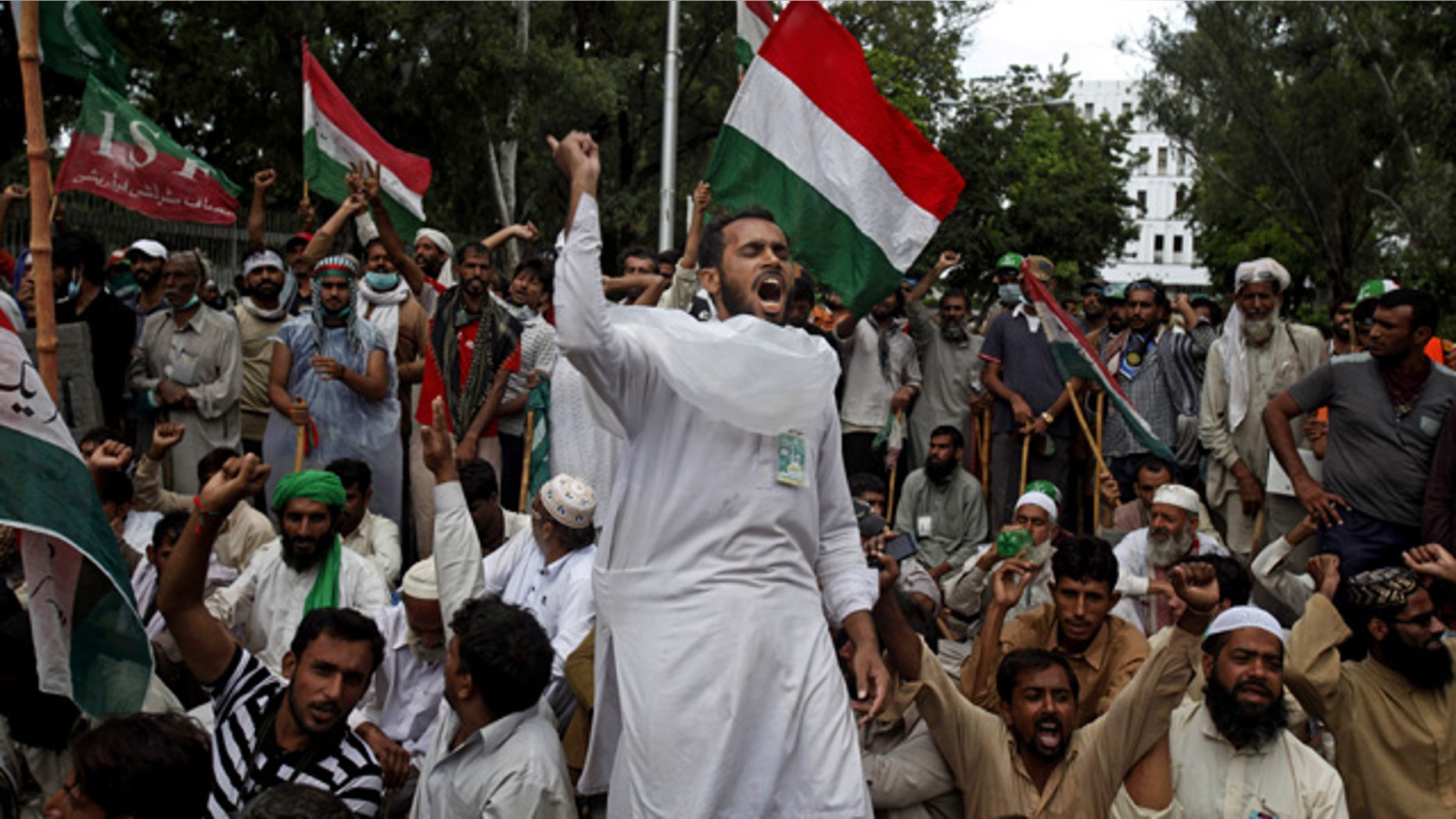 September 1, 2014: Supporters of anti-government Muslim cleric Tahir-ul-Qadri chant slogans during a protest close to the Prime Minister's home in Islamabad, Pakistan. (AP Photo/Anjum Naveed)