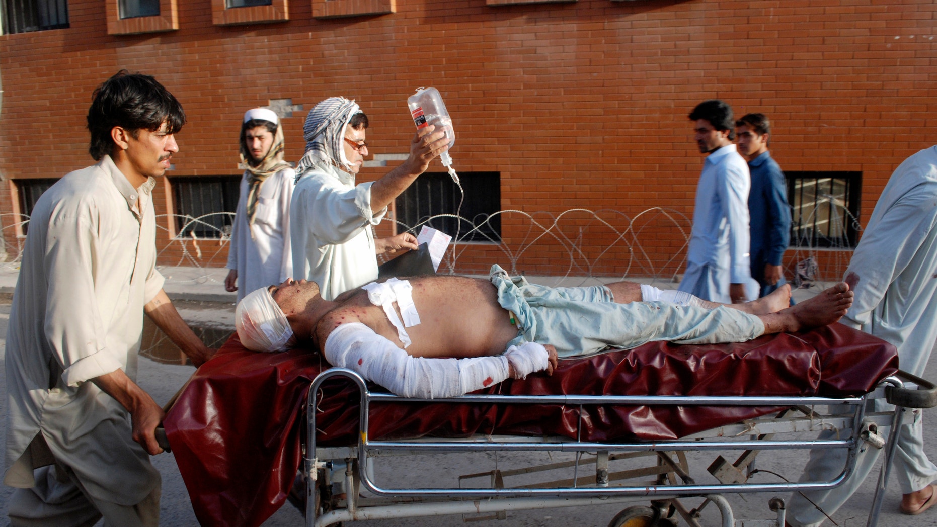 May 17, 2013 - A Pakistani man injured in a bomb blast in a mosque in the Malakand district of Khyber Pakhtunkhwa province, is brought to a hospital in Peshawar, Pakistan.