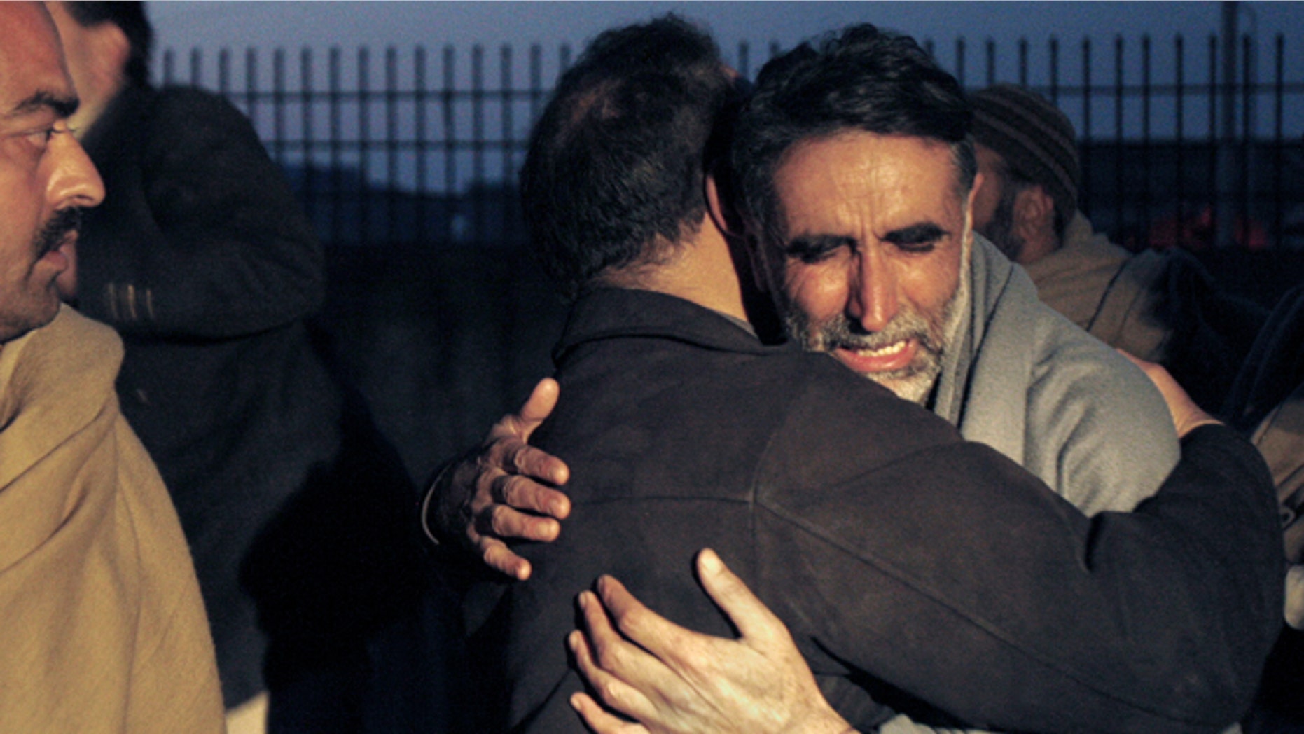 Jan. 1, 2013: A father of an aid worker, who was killed by gunmen, mourns the death of his daughter at a hospital in Swabi, Pakistan.