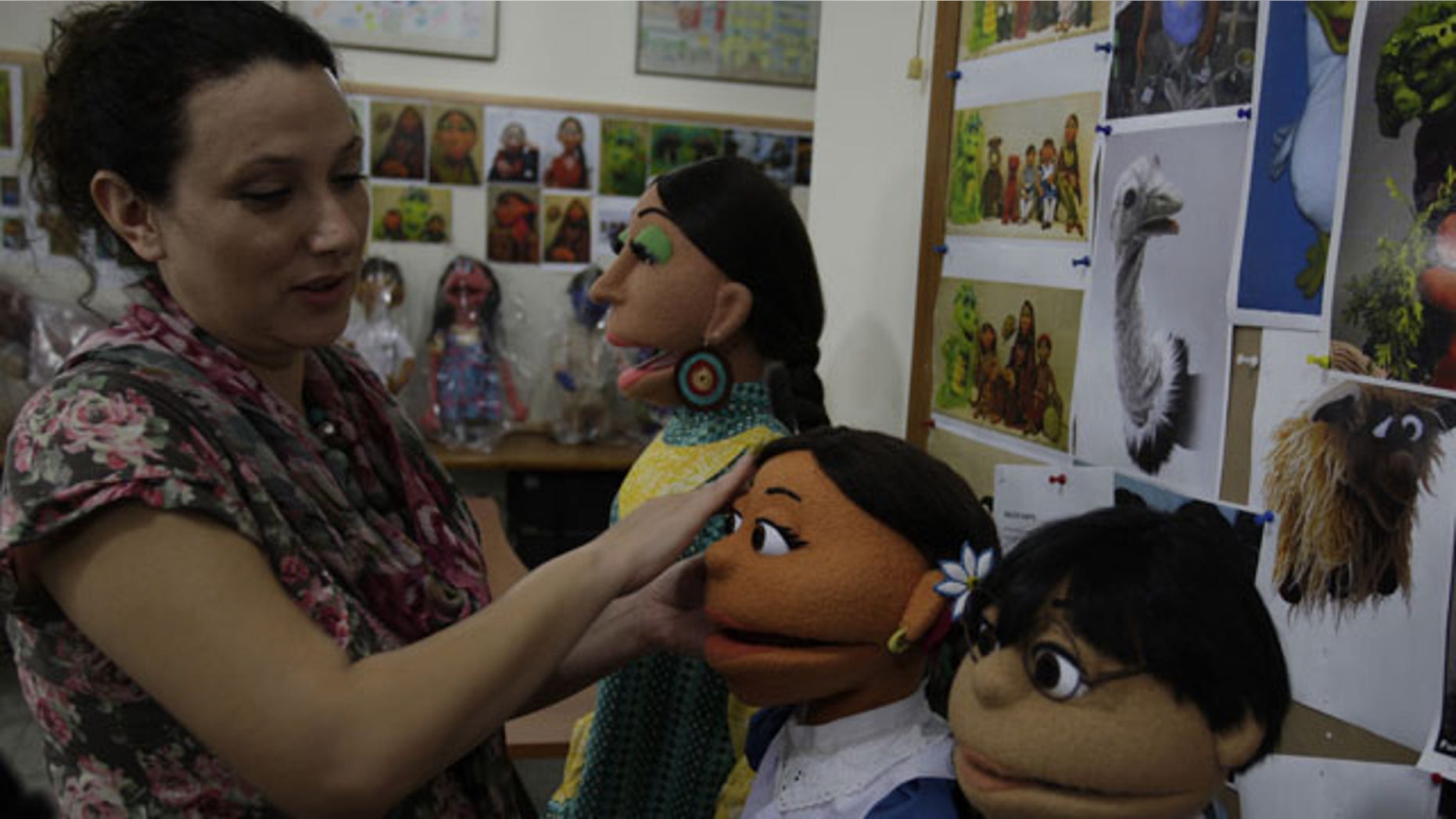 October 13, 2011: A Pakistani artist gives final touches to characters of Pakistani Sesame Street in Lahore, Pakistan.