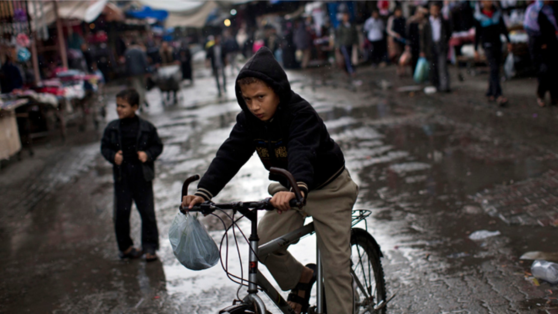 Nov. 23: A Palestinian rides a bike in the Jebaliya refugee camp, north Gaza Strip.