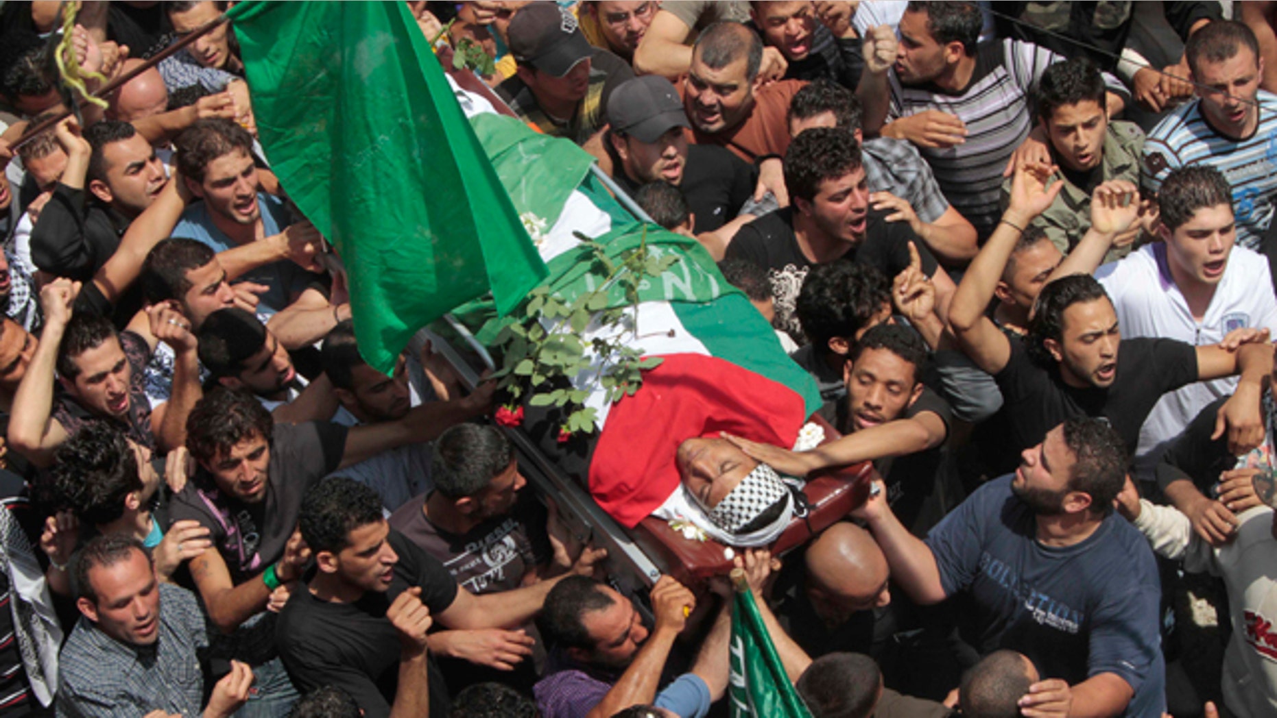 May 16: Palestinian mourners carry the body of a Palestinian man who was killed when Israeli soldiers opened fire on Sunday at protesters who approached the northern Israeli border with Lebanon. Israeli troops clashed with Arab protesters along three hostile borders on Sunday, leaving as many as 12 people dead and dozens wounded.
