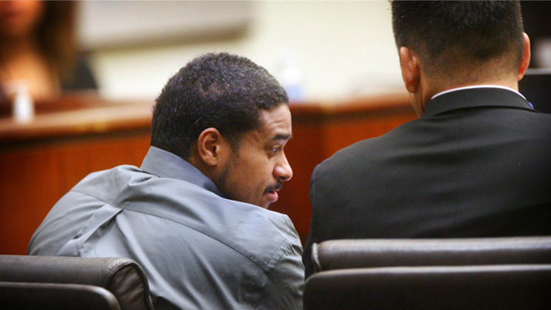 John Hernandez Felix confers with his attorney Michael Rowlands on Thursday, Oct. 13, 2016 in Indio, Calif.