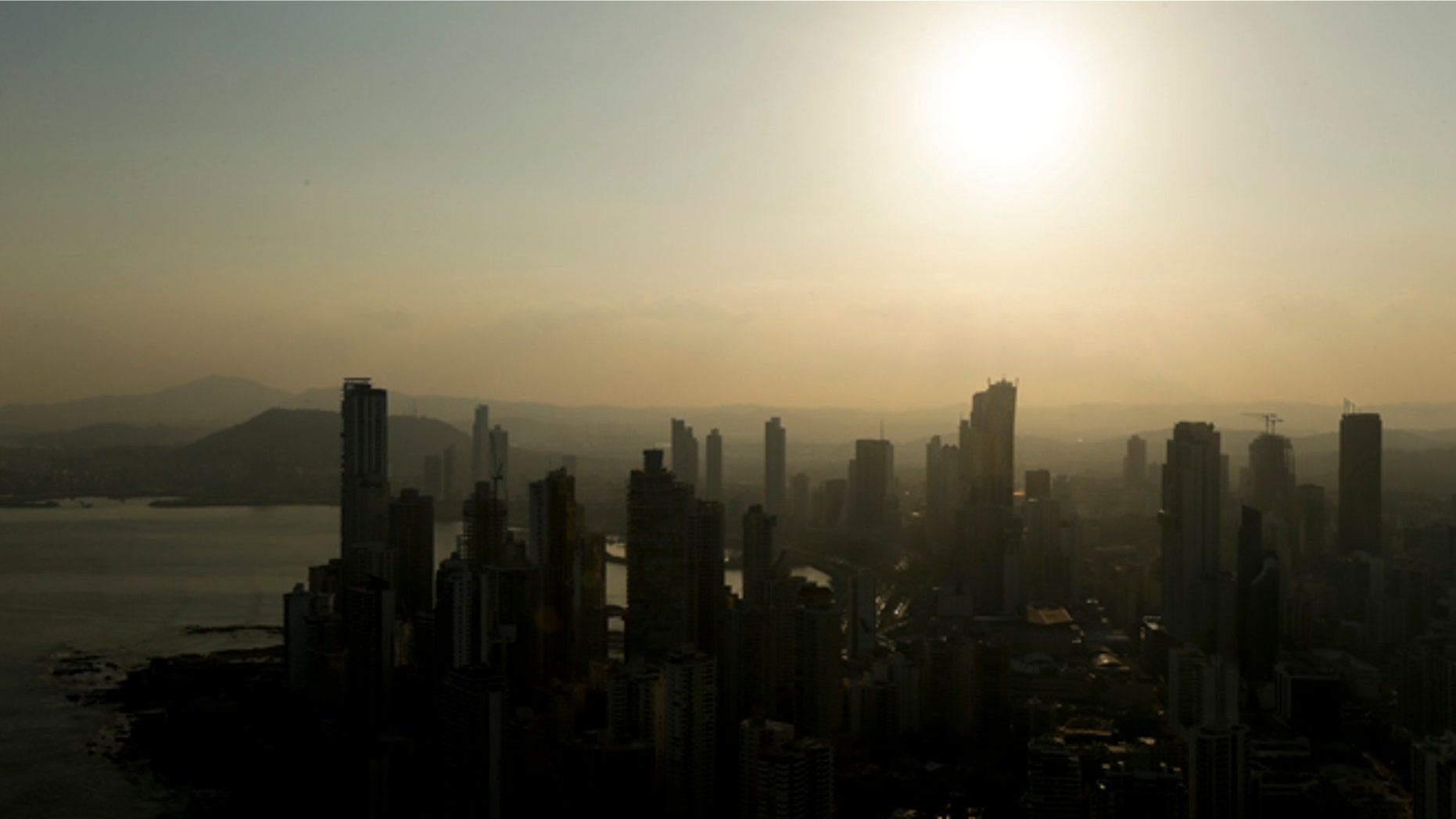 Panama City skyline is silhouette at sunset in Panama, Monday, April 4, 2016.