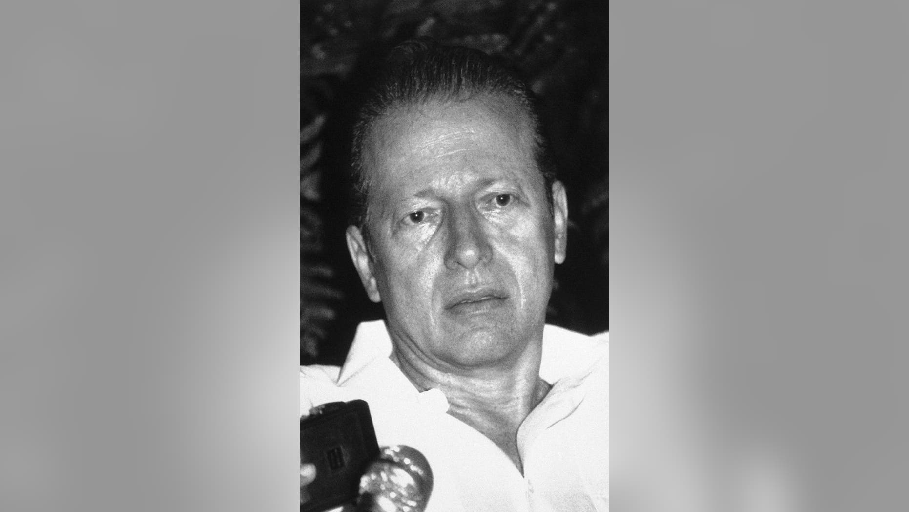 FILE - In this Feb. 25, 1988 file photo, Panama's President Eric Arturo Delvalle speaks with reporters at his home in Panama City after ordering General Manuel Antonio Noriega to step down as military chief. Delvalle died in Cleveland, Ohio, on Friday, Oct. 2, 2015. He was 78 years old. (AP Photo/Carlos Guardia, File)