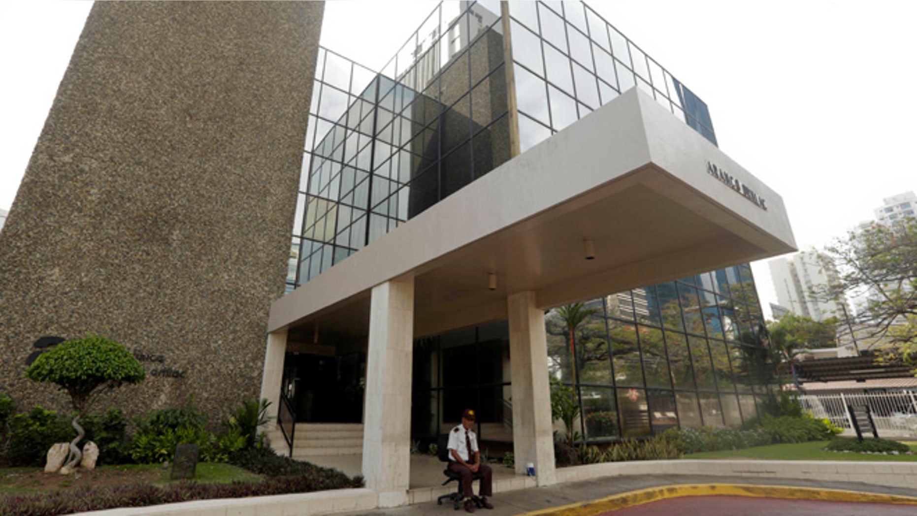A security guard sit outside the Mossack Fonseca law firm in Panama City, Sunday, April 3, 2016. German daily Sueddeutsche Zeitung says it has obtained a vast trove of documents detailing the offshore financial dealings of the rich and famous. The International Consortium of Investigative Journalism says the latest trove contains includes nearly 40 years of data from the Panama-based law firm, Mossack Fonseca. The company didnÃt immediately respond to a request for comment. (AP Photo/Arnulfo Franco)