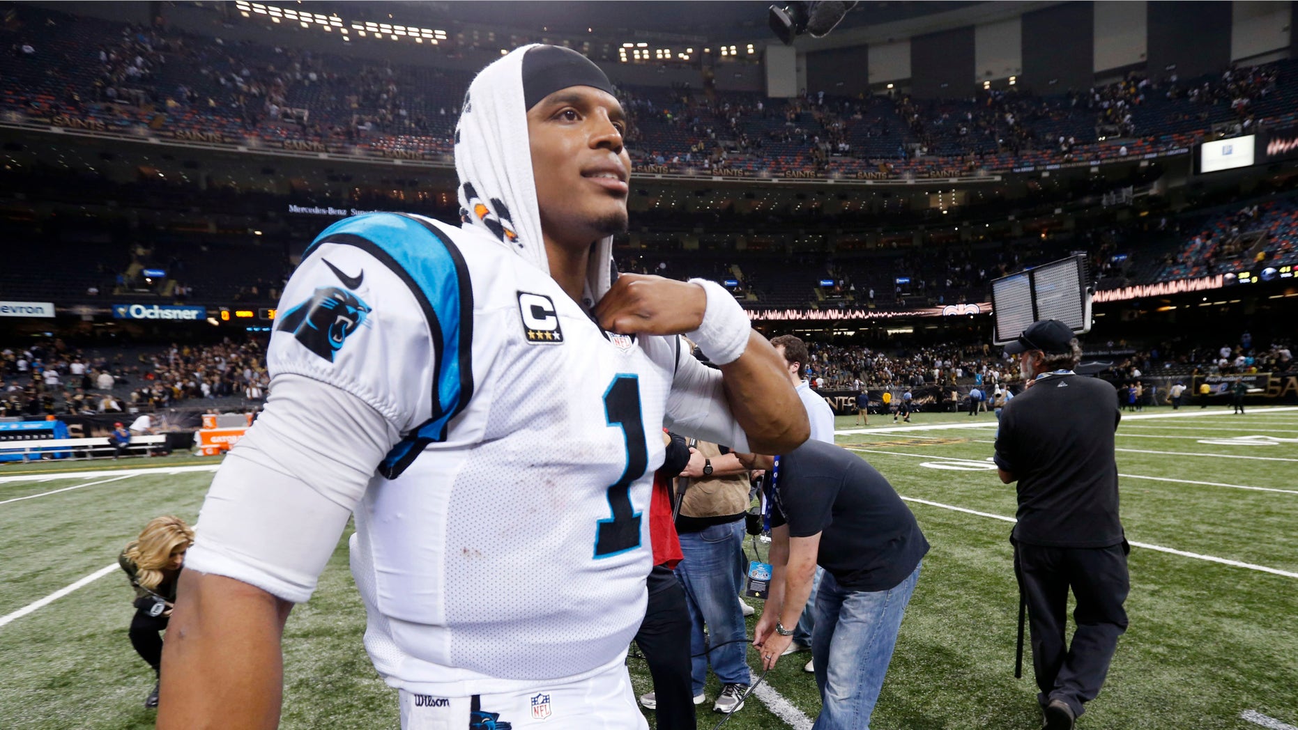 Carolina Panthers quarterback Cam Newton (1) walks on the field after an NFL football game against the New Orleans Saints in New Orleans, Sunday, Dec. 6, 2015. The Panthers won 41-38. (AP Photo/Bill Feig)