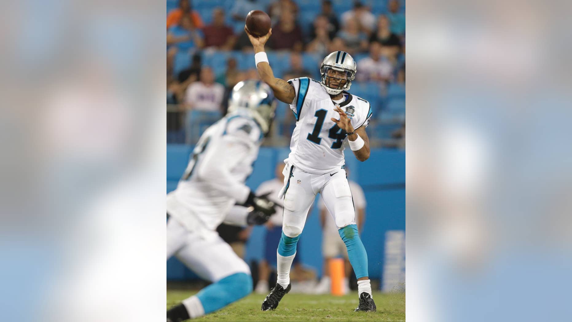 FILE - In this Aug. 8, 2014, file photo, Carolina Panthers' Joe Webb (14) throws a pass against the Buffalo Bills during the second half of a preseason NFL football game in Charlotte, N.C. Panthers third-string quarterback Joe Webb could be the beneficiary of a rib injury to Cam Newton. The Panthers only kept two QBs last season, but with Newton hurting coach Ron Rivera is strongly considering keeping three QBs. (AP Photo/Bob Leverone, File)