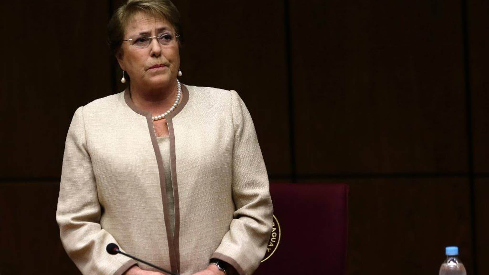 In this Aug. 21, 2015 photo, Chile's President Michelle Bachelet attends a congressional session, during her official visit, in Asuncion, Paraguay. Bachelet was once among Latin America's most popular leaders. Although she still enjoys a majority in Congress, many reforms she campaigned for seem doubtful amid behavior some view as erratic. (AP Photo/Jorge Saenz)