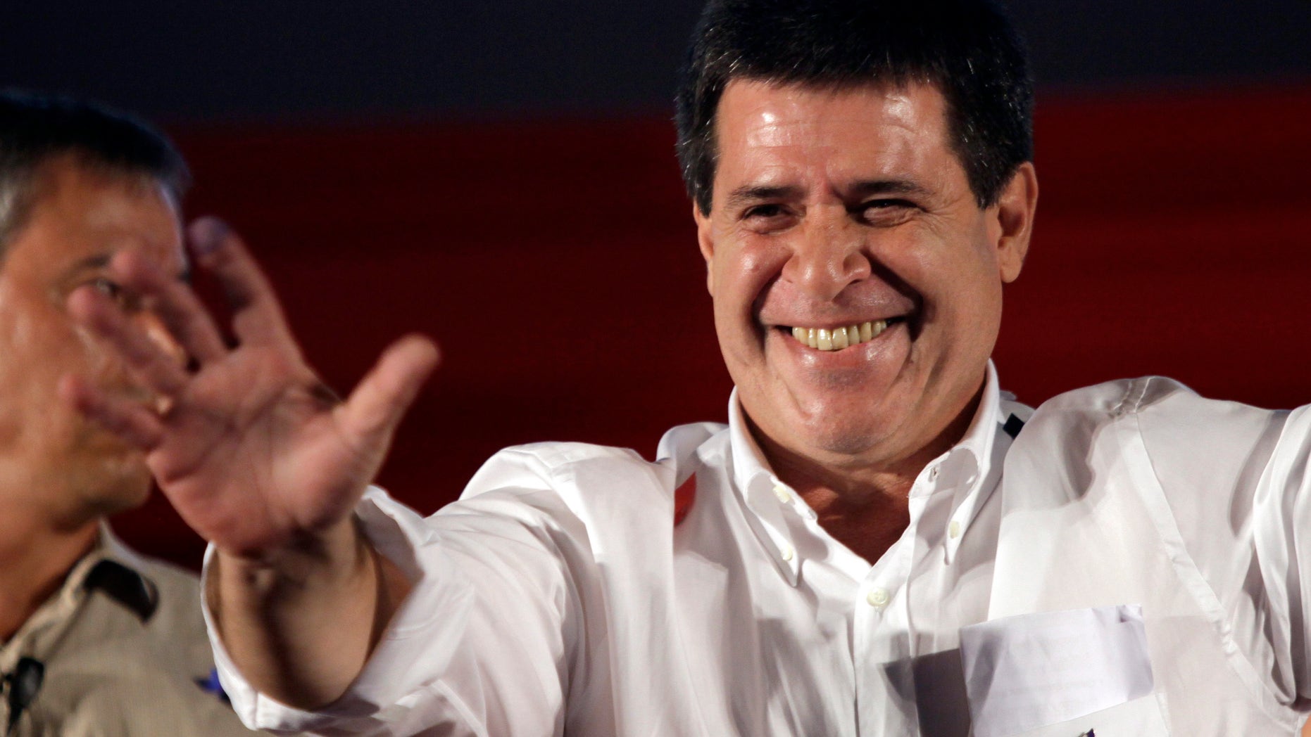 April 21, 2013 - Colorado Party's presidential candidate Horacio Cartes, waves to supporters after presidential election results were made official in Asuncion, Paraguay.