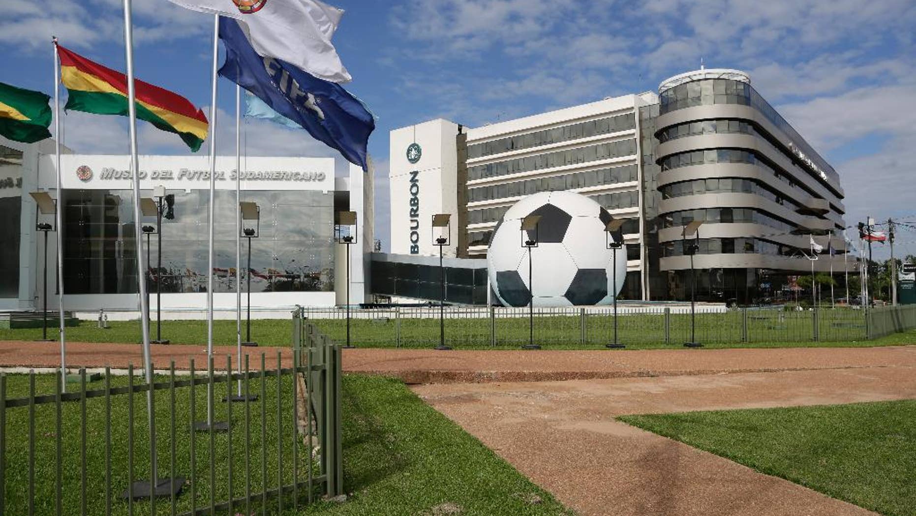 FILE - In this June 3, 2015 file photo, CONMEBOL headquarters sits on a 100-acre complex and includes a museum, a five-star luxury hotel, a large convention center and heliport, in Asuncion, Paraguay. Paraguay's president signed a law on Thursday, June 25, 2015 repealing the immunity that this headquarters enjoyed for nearly two decades, part of the fallout from a U.S. investigation into an alleged bribery scheme in FIFA. (AP Photo/Jorge Saenz, File)