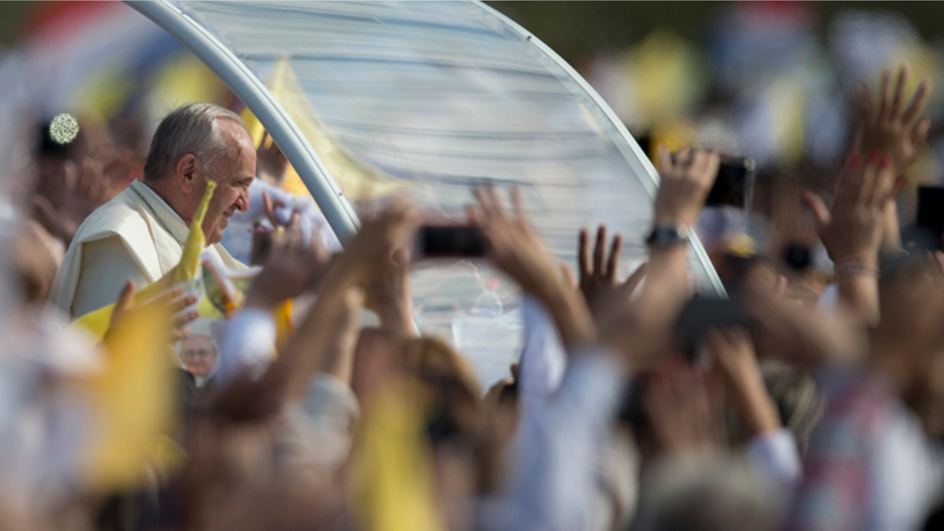 Pope Francis arrives to celebrate a mass in Asuncion, Paraguay, Sunday, July 12, 2015. The Pope arrived Friday afternoon in the Paraguayan capital of Asuncion on the final leg of his three-nation tour of South America's poorest countries that included Ecuador and neighboring Bolivia. (AP Photo/Natacha Pisarenko)