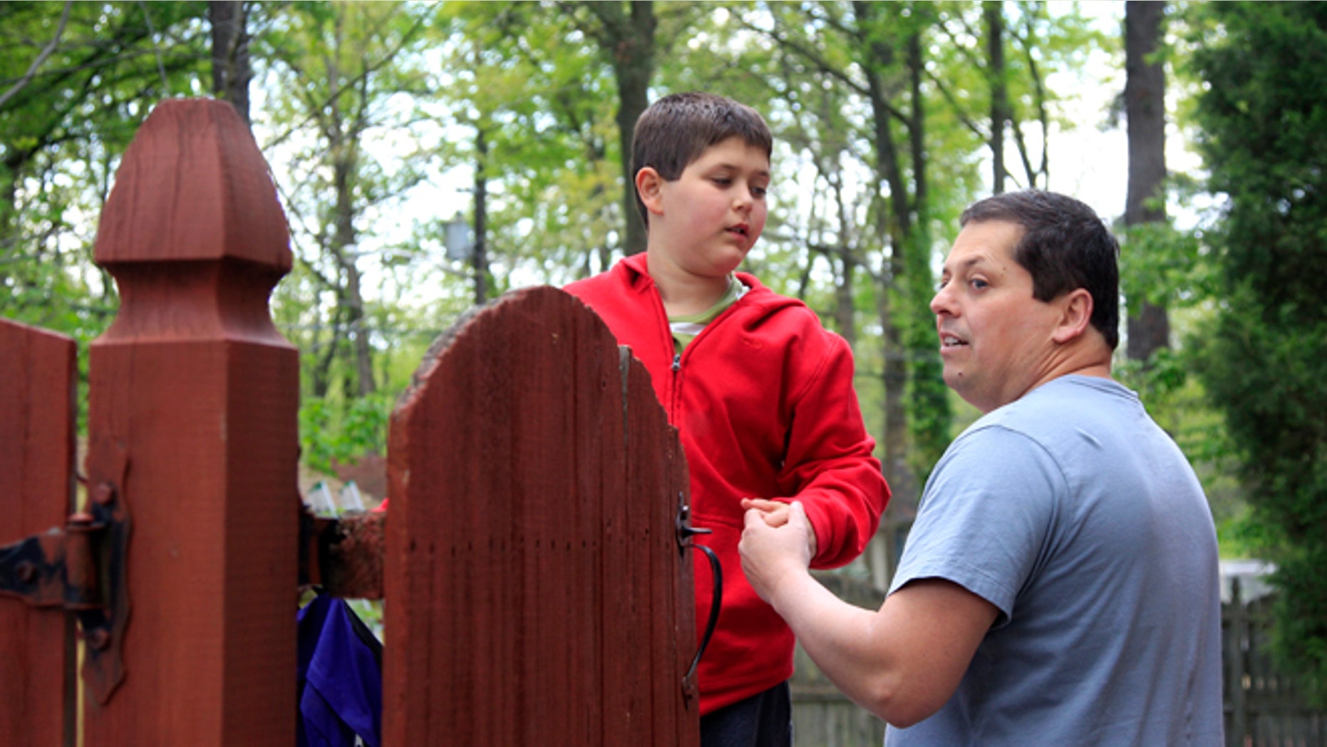 April 25, 2012: Stuart Chaifetz stands with his son Akian Chaifetz, 10, at their home in Cherry Hill, N.J.