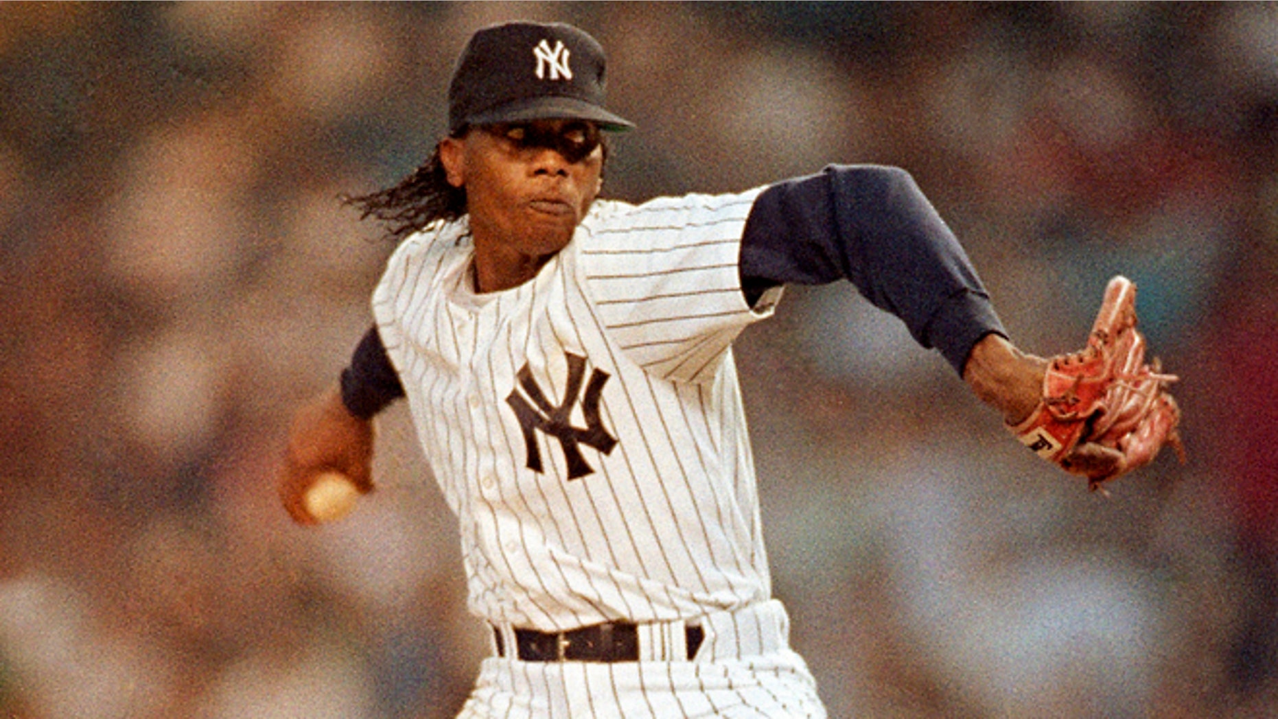 FILE - In this May 14, 1991, file photo, New York Yankees' Pascual Perez throws during the second inning of a baseball game against the California Angels at Yankee Stadium in New York. Police in the Dominican Republic say the former major league pitcher has been killed in his home during an apparent robbery. (AP Photo/Mark D. Phillips, File)