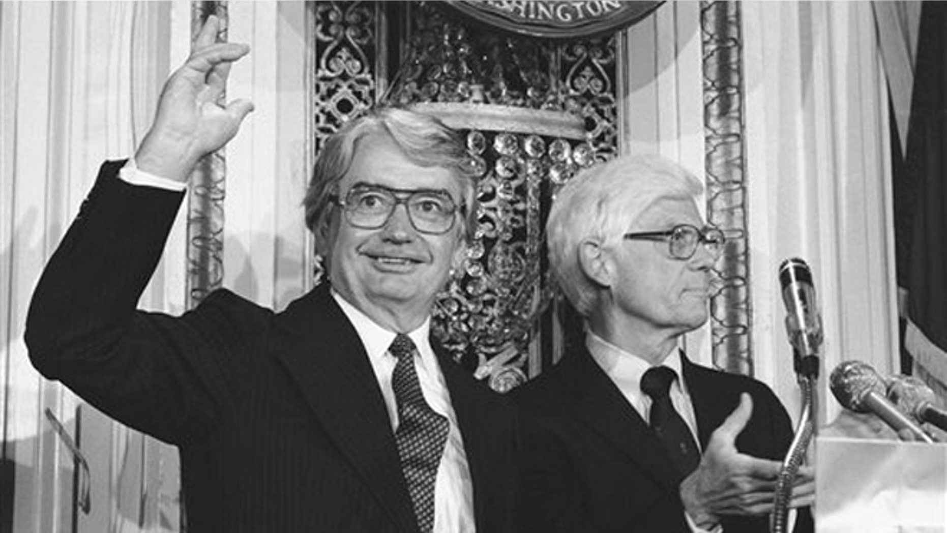 FILE- In this Aug. 25, 1980 file photo, Wisconsin Gov. Patrick J. Lucey, left, waves to the audience at the National Press Club in Washington after Independent presidential candidate John B. Anderson of Illinois, right, announced Lucey would be his vice presidential running mate. Lucey, a hard-nosed Democratic politician who later became ambassador to Mexico, died Saturday, May 10, 2014. He was 96. (AP Photo/File)