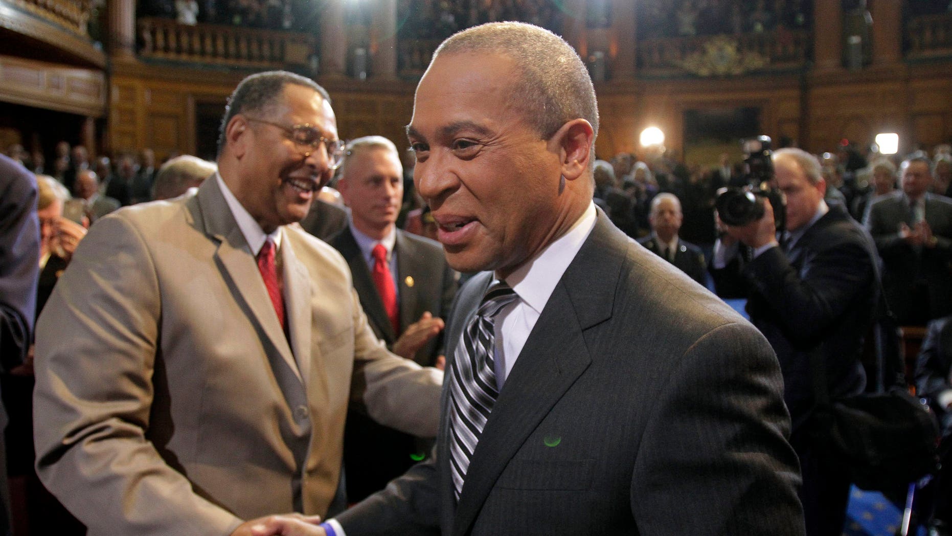 Jan. 6: Newly re-elected Massachusetts. Gov. Deval Patrick, right, is greeted by Chief Justice of the Massachusetts Supreme Court Roderick Ireland, left, as Patrick arrives in the House Chamber at the Statehouse, in Boston.