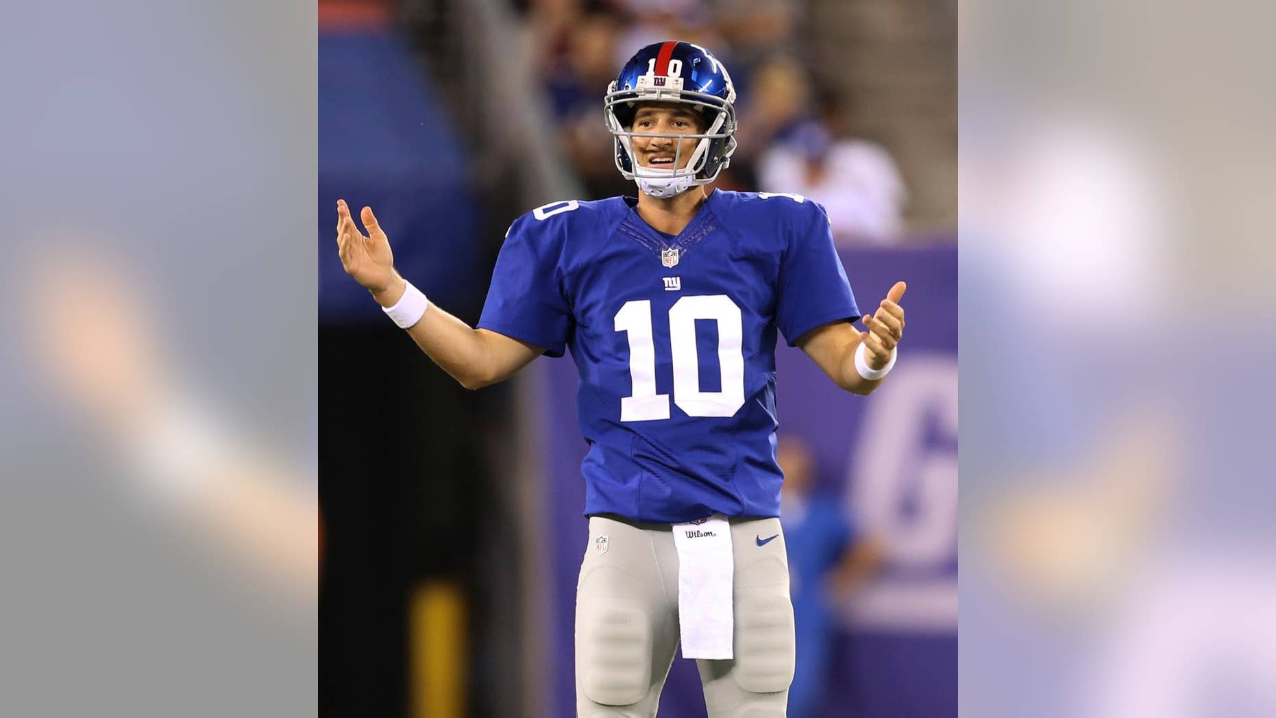 New York Giants quarterback Eli Manning reacts during the first half of an NFL preseason football game against the New England Patriots, Thursday, Aug. 28, 2014, in East Rutherford, N.J. (AP Photo/John Minchillo)