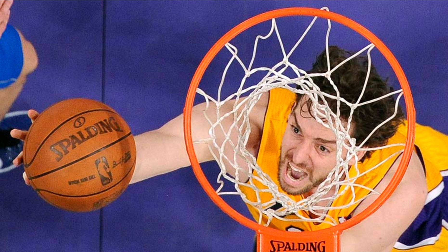 Los Angeles Lakers forward Pau Gasol, of Spain, puts up a shot during the first half in Game 2 of a second-round NBA playoff basketball series against the Dallas Mavericks, Wednesday, May 4, 2011, in Los Angeles. (AP Photo/Chris Pizzello)