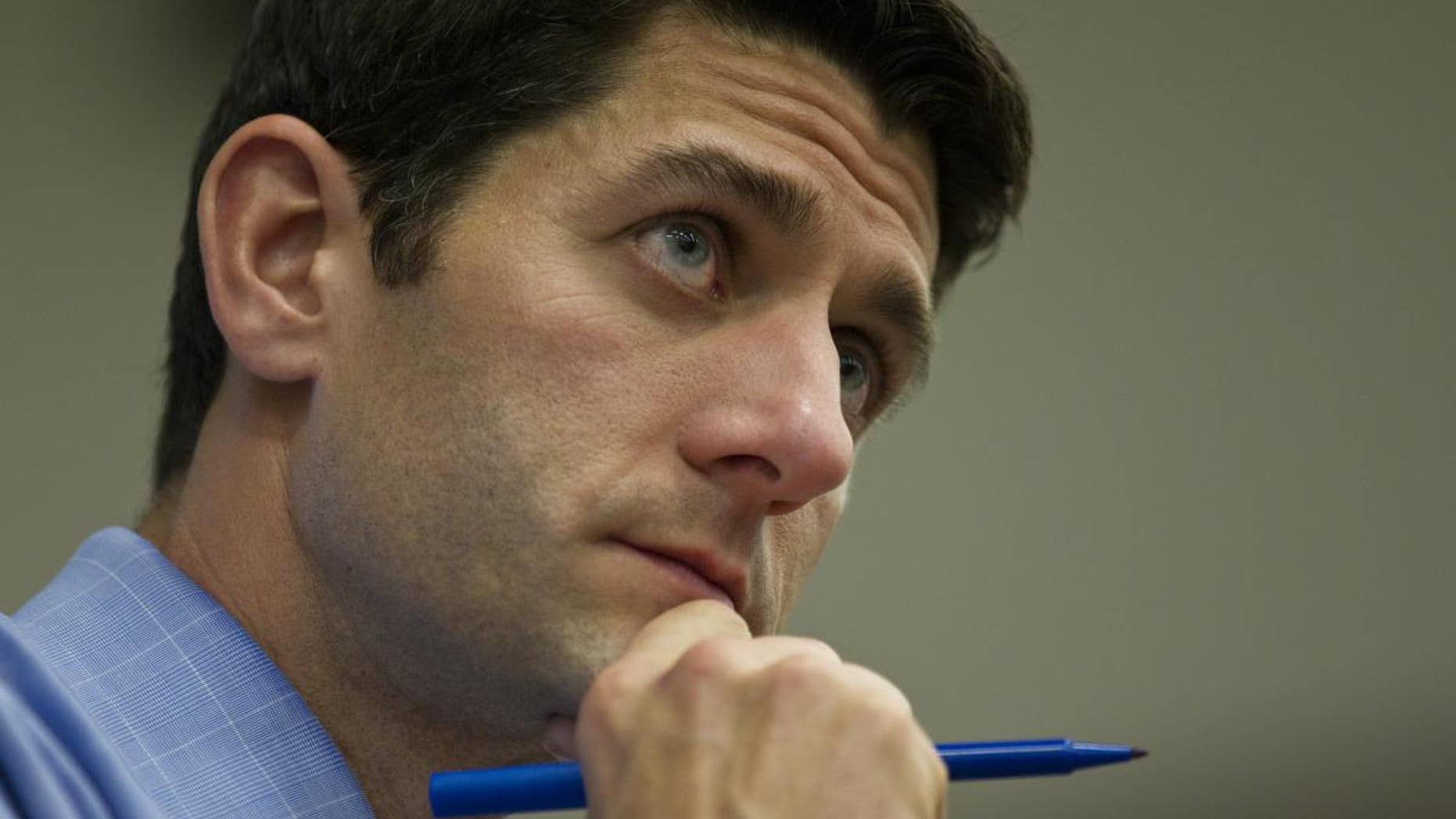 U.S. Rep. Paul Ryan, R-Wis. ponders a question during a listening session Tuesday, April, 26, 2011. (AP Photo/Jeffrey Phelps)