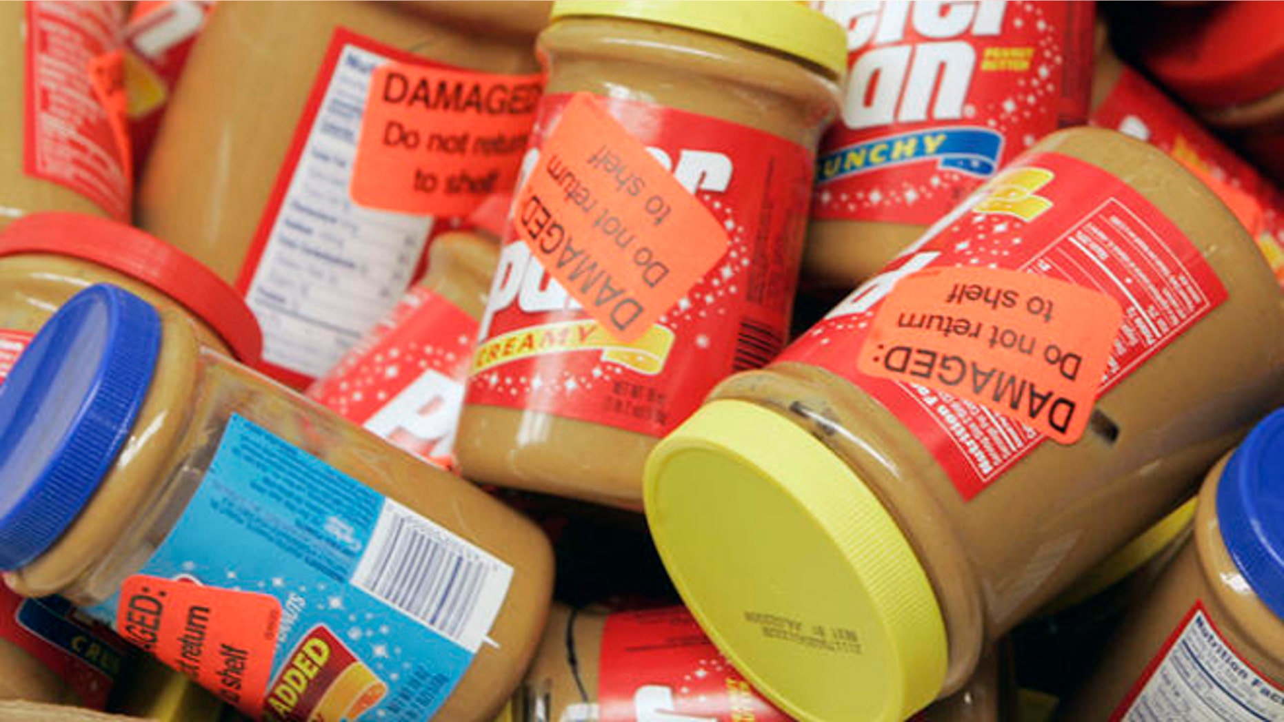 ** FILE ** Returned jars of Peter Pan Peanut Butter are shown at a super market, in this Feb. 16, 2007, file photo in Atlanta. ConAgra Foods Inc. has extended its recall of all peanut butter produced at a plant in Georgia by more than a year, back to October 2004, the Food and Drug Administration said Friday, March 9, 2007. (AP Photo/John Bazemore, file)