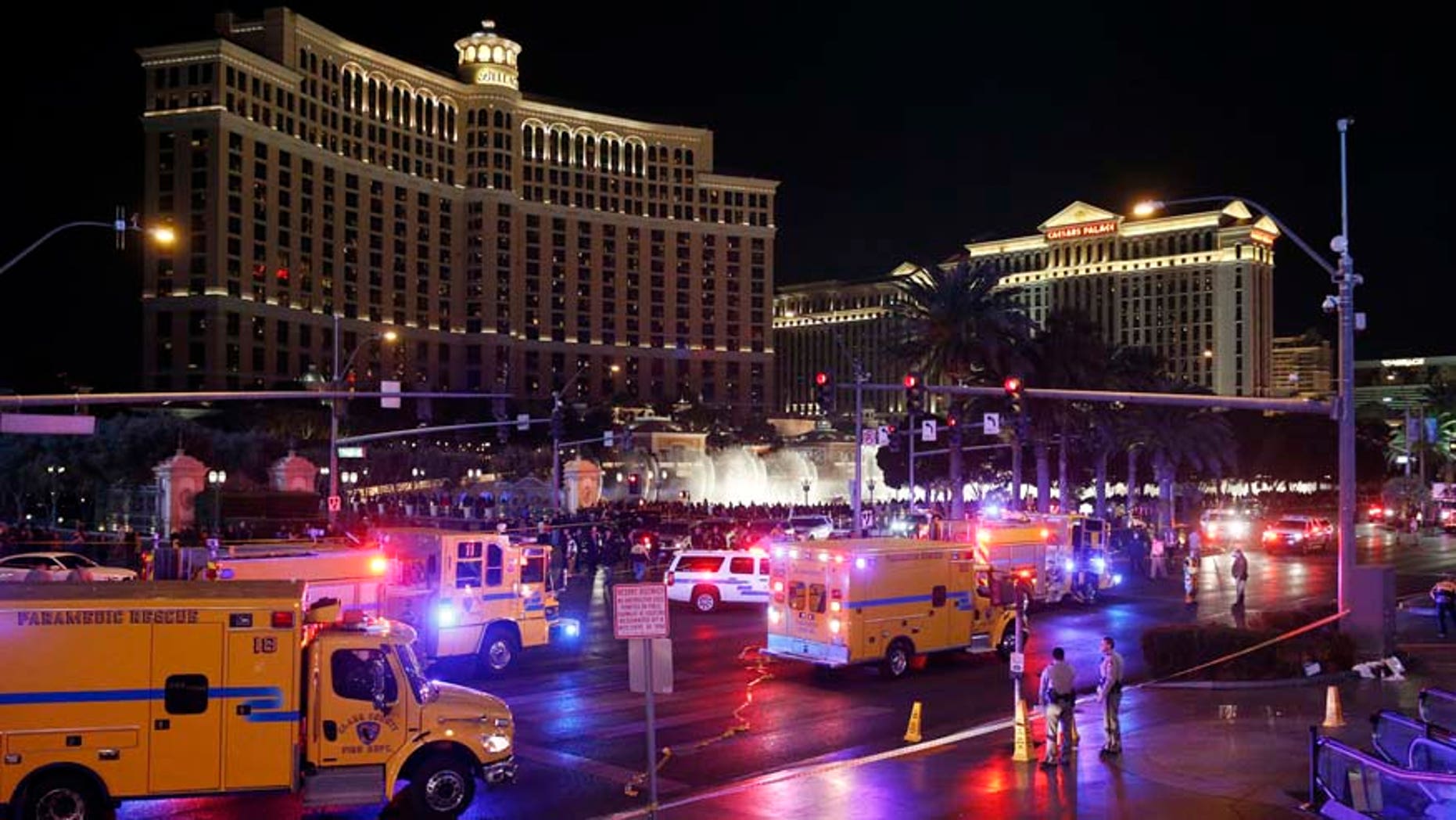 FILE - In this Dec. 20, 2015 file photo, police and emergency crews respond to the scene of a car accident along Las Vegas Boulevard in Las Vegas, after a woman drove her car into a crowd of tourists outside the Planet Hollywood and Paris casino-hotels. Pedestrian deaths surged by an estimated 10 percent last year as the economy improved, the price of gas plunged and motorists put more miles behind the wheel than ever before, according to an analysis of preliminary state traffic fatality data. (AP Photo/John Locher, File)