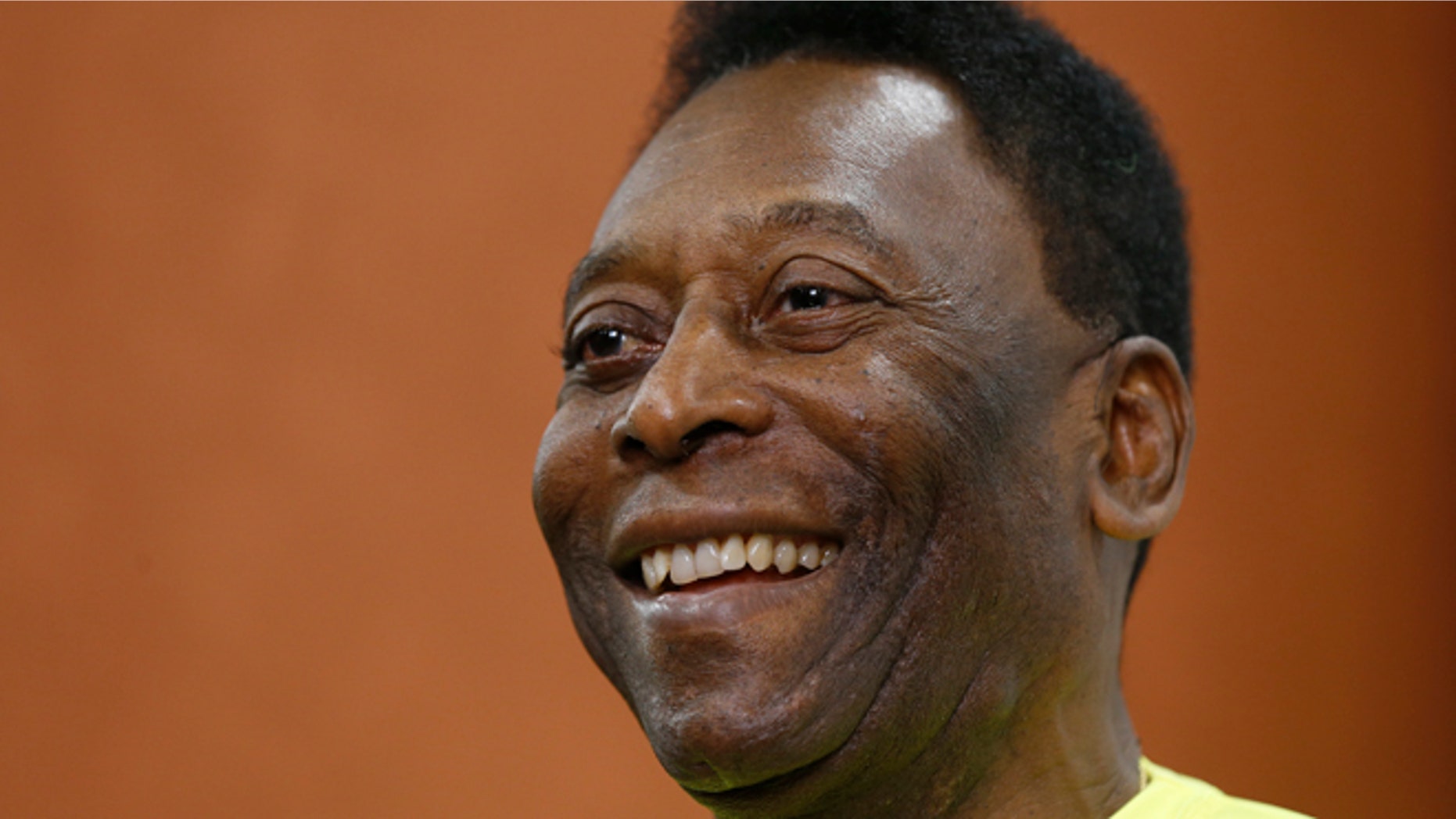 FILE - In this March 20, 2015 file photo, Brazilian soccer legend Pele smiles during a media opportunity at a restaurant in London. Pele said on Friday, Aug. 5, 2016 that his poor health will keep him from attending the opening ceremony of the Rio Olympics. (AP Photo/Kirsty Wigglesworth, File)