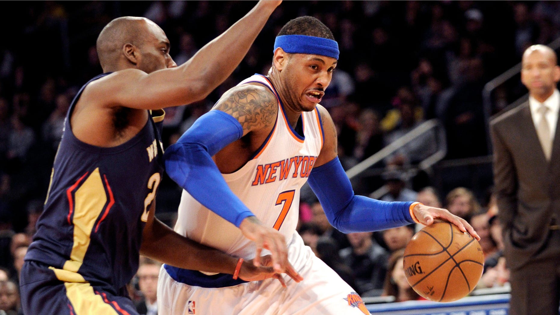 Carmelo Anthony drives to the basket a he is guarded by Quincy Pondexter on Monday, Jan. 19, 2015.