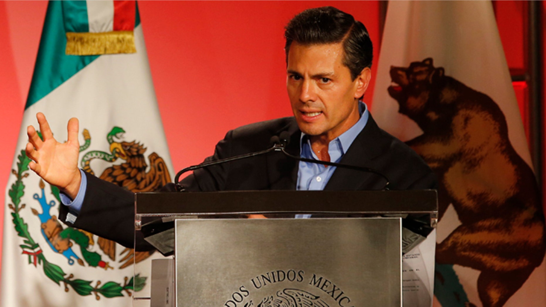 Mexico's President Enrique Pena Nieto speaks to Mexican-American community leaders and others in Los Angeles, Monday, Aug. 25, 2014. (AP Photo/Damian Dovarganes)