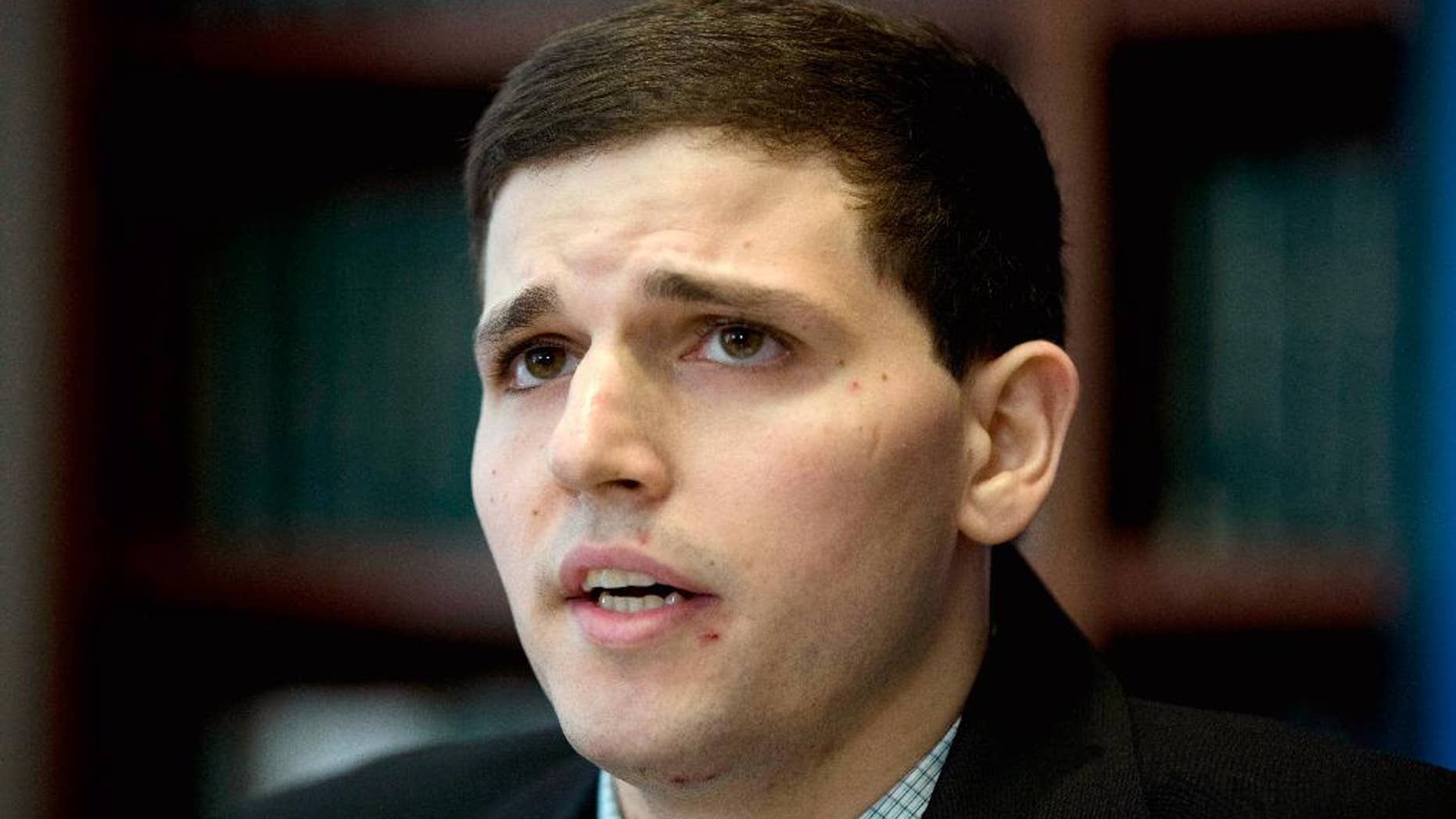 FILE - In this June 8, 2015 file photo, James Vivenzio speaks during a news conference in Philadelphia. Vivenzio, a former Penn State student from Great Falls, Va., who is suing over alleged hazing by his former fraternity, toured the fraternity house with his parents and lawyers for the involved parties seeking evidence for the case. (AP Photo/Matt Rourke, File)