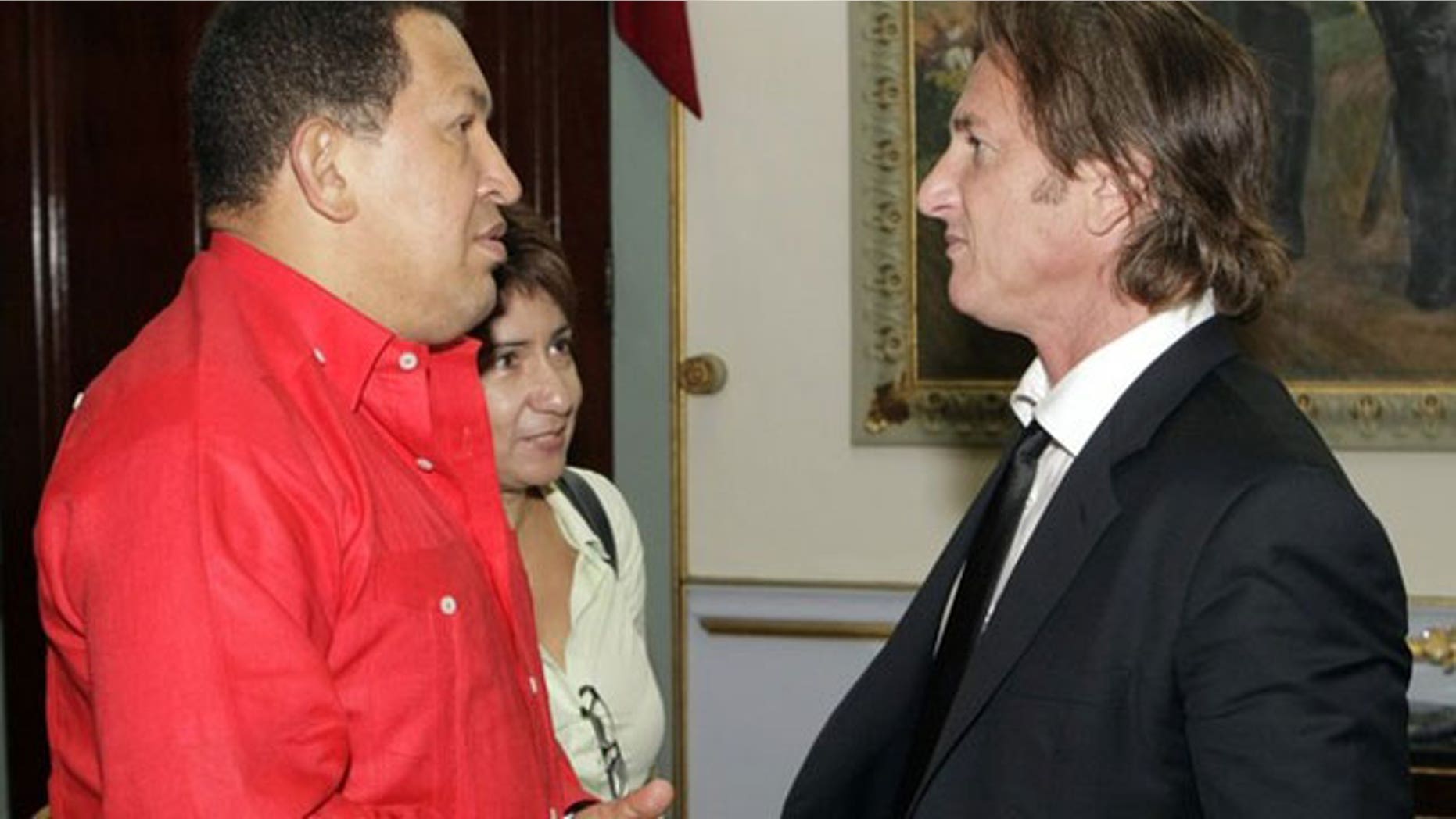 Oct. 2009: Sean Penn (r) chats with Venezuelan President Hugo Chavez at Miraflores Palace in Caracas.