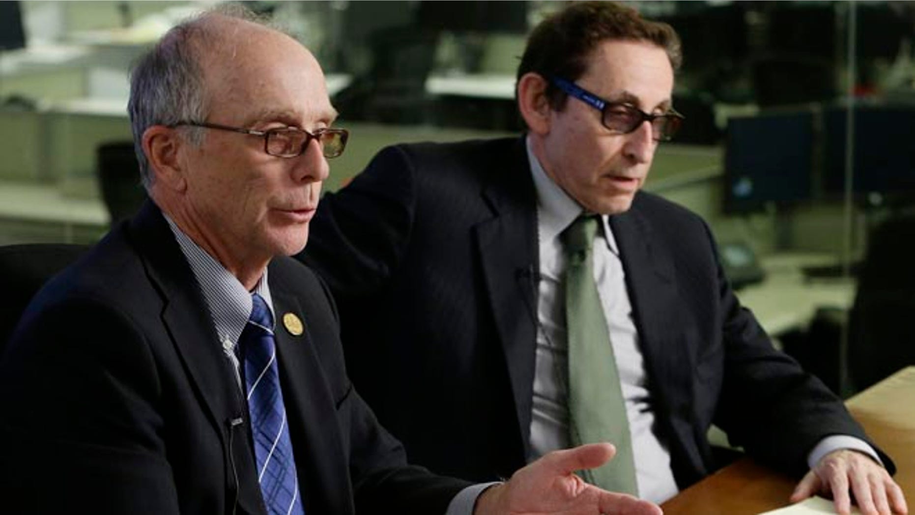 June 5, 2013: Penn State board chair Keith Masser, left, and outreach chair Joel Myers respond to questions during a news interview in New York.