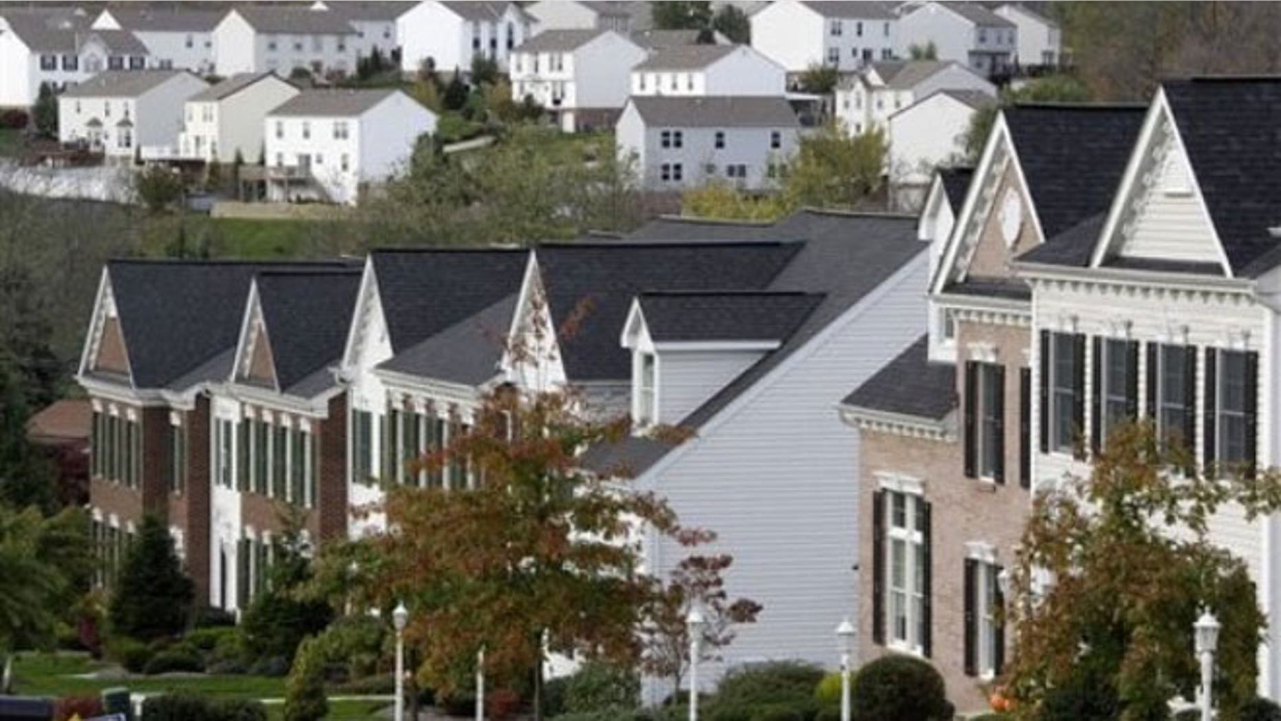 This Oct. 18, 2011 file photo, shows two home developments in the Pittsburgh suburb Canonsburg, Pa. For the first time in a century, America's largest cities are growing at a faster rate than their surrounding suburbs.