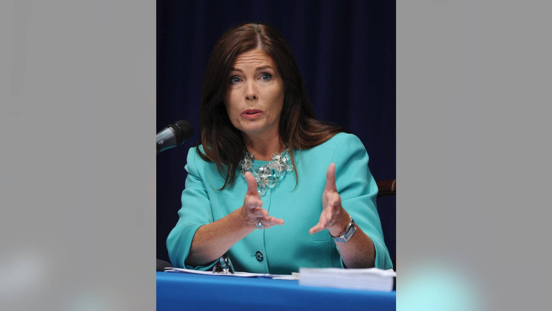 In this June 23, 2014 file photo, Pennsylvania state Attorney General Kathleen Kane fields questions from the media at a news conference in Harrisburg, Pa. Kane said Wednesday, Nov. 12, 2014 four of her employees have been fired and 11 suspended without pay for involvement in a pornographic email scandal that also prompted a state Supreme Court justice to step down. (AP Photo/Bradley C Bower)