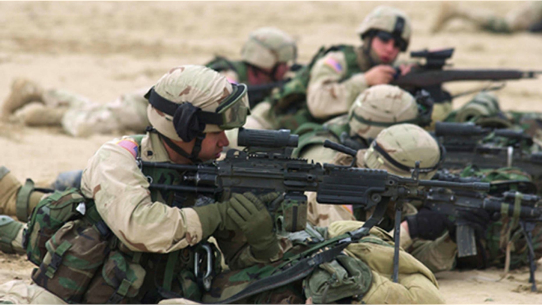 SPINBOLDAK, AFGHANISTAN - JANUARY 29: U.S. soldiers from the 82nd Airborne Division provide cover for a search operation being conducted January 29, 2003 in Spinboldak, southeastern Afghanistan, during Operation Devil Impact. A U.S. military spokesman said the soldiers found stashes of cooking oil, food, boots and rockets January 30 in caves high in a southeastern Afghan mountain, evidence a hostile group may have been using the complex as a supply hub. (Photo by Dennis Steele/U.S. Army/Getty Images)