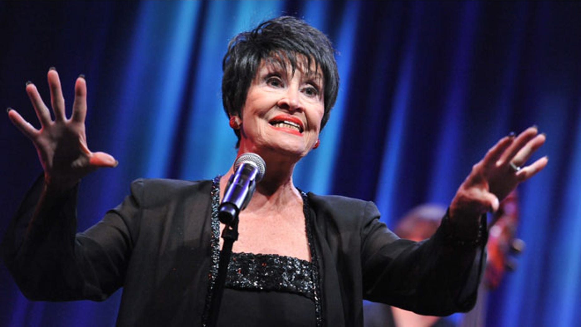 FILE - In a Sunday, Aug. 2, 2015 file photo, Chita Rivera performs during the âChita Rivera: A Lot of Livinâ to Doâ segment of the PBS 2015 Summer TCA Tour held at the Beverly Hilton Hotel in Beverly Hills, Calif. Rivera postponed her show at at Cafe Carlyl after being injured in a fall over the Christmas holiday. Rivera, who was to appear at the legendary venue on Jan. 12-23, will now take the stage from April 19-30 as she recovers from a pelvic stress fracture. (Photo by Richard Shotwell/Invision/AP, File)