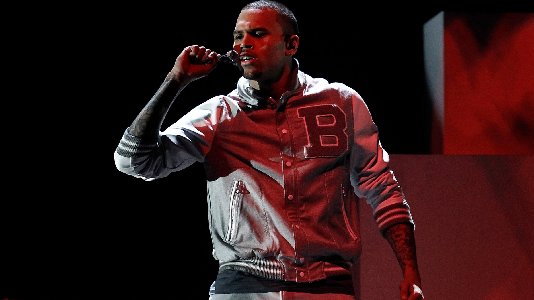 Feb. 12, 2012: File photo: Chris Brown performs during the 54th annual Grammy Awards, in Los Angeles. A judge in Los Angeles ordered a further review of Brown's community service on Monday, Sept. 24, 2012.
