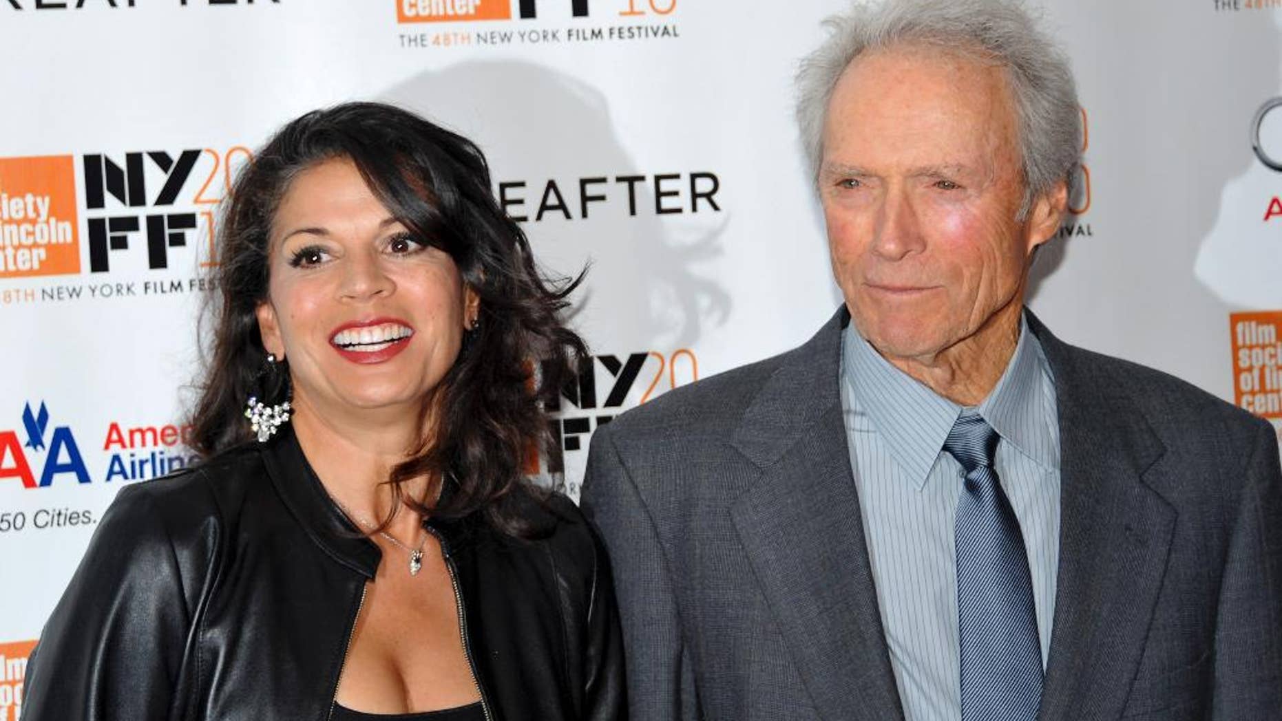 FILE - In this Oct. 10, 2010 file photo, director and producer Clint Eastwood, right, and wife Dina Marie Eastwood attend the premiere of "Hereafter" at Alice Tully Hall during the 48th New York Film Festival, in New York. A Monterey County Superior Court judge finalized the couple's divorce after 18 years of marriage on Tuesday, Dec. 23, 2014. (AP Photo/Evan Agostini, File)