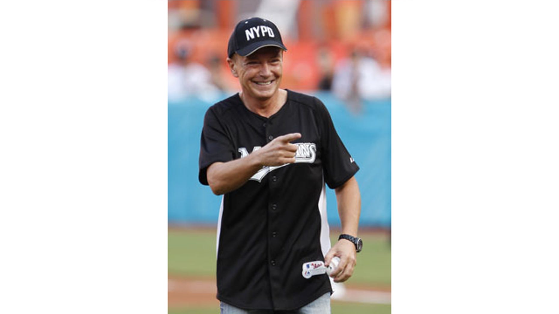 FILE - This July 9, 2011 file photo shows actor David Cassidy after throwing out a ceremonial first pitch before a baseball game between the Florida Marlins and the Houston Astros, in Miami. (AP Photo)