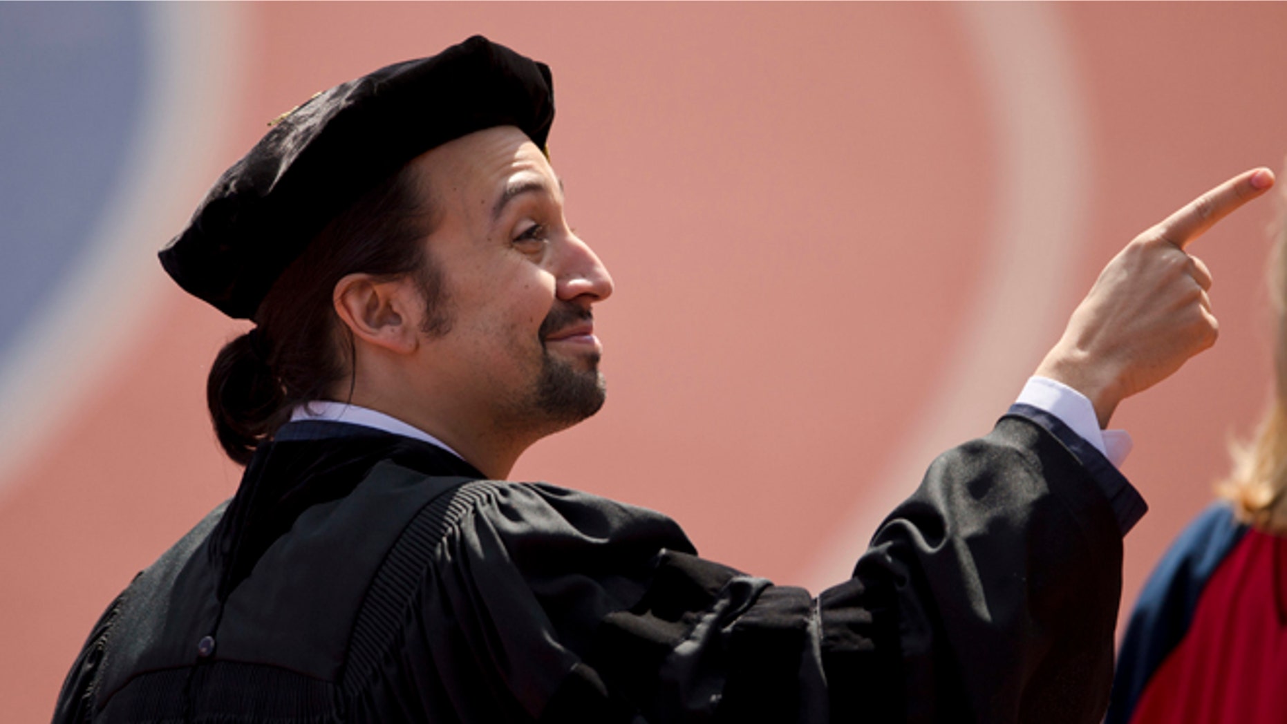 Lin-Manuel Miranda, creator of the Broadway musical "Hamilton," pointsn during the University of Pennsylvania commencement ceremony, Monday, May 16, 2016, in Philadelphia. Miranda will speak at the ceremony and receive an honorary degree. (AP Photo/Matt Rourke)