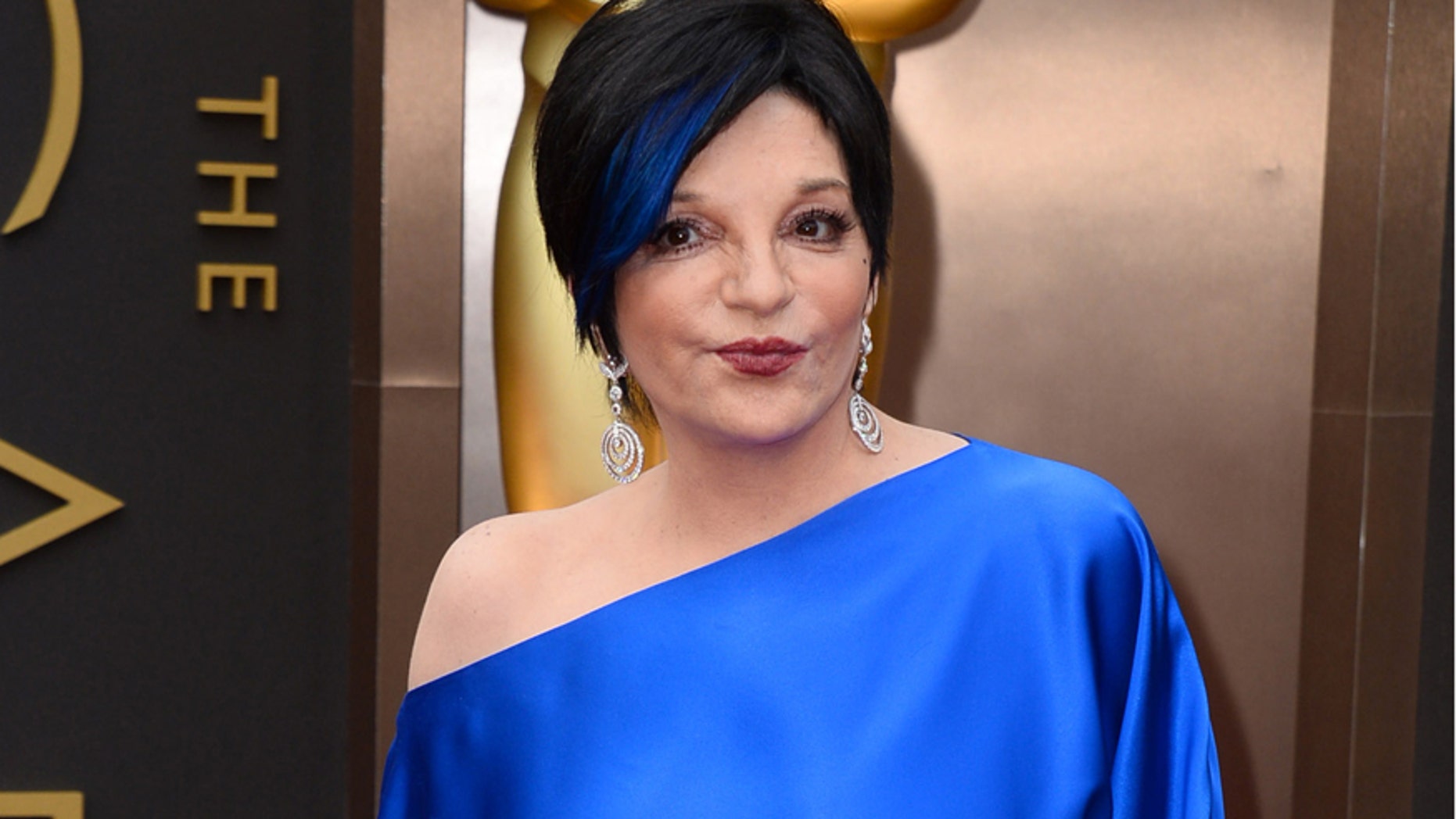FILE - In this March 2, 2014 file photo, Liza Minnelli arrives at the Oscars in Los Angeles. Minnelli is said to be resting comfortably in a California hospital after undergoing back surgery this week and shes thanking fans for their well wishes.