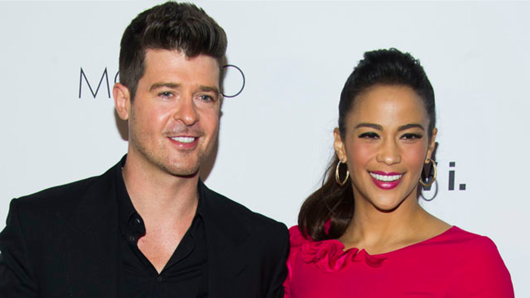 FILE - In this Wednesday, Oct. 23, 2013 file photo, Robin Thicke and Paula Patton attend the sixth annual GQ Gentlemen's Ball in New York. Patton has filed for divorce from Thicke and is asking for joint custody of their son. (Photo by Charles Sykes/Invision/AP, file)