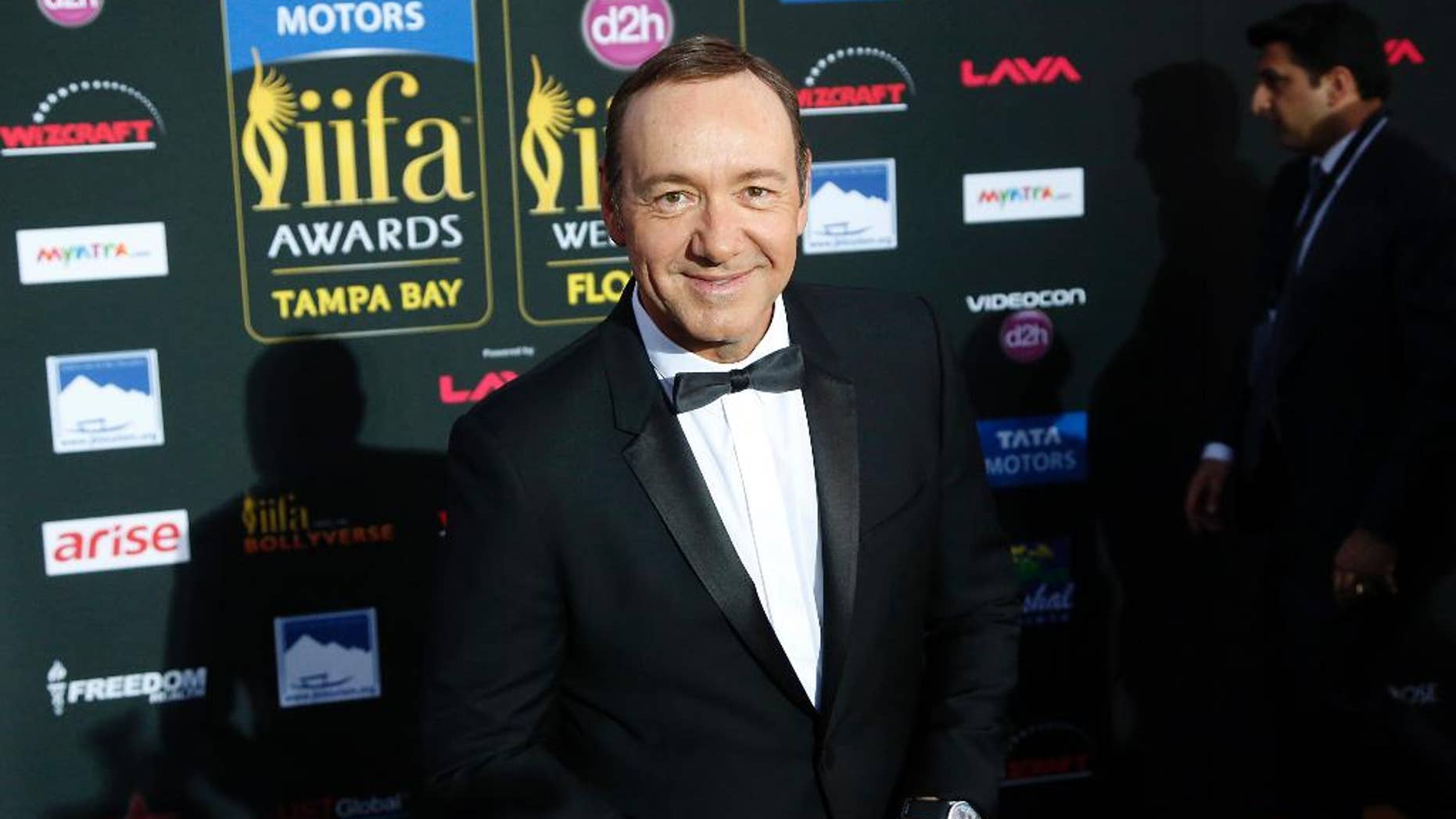 FILE - In a April 26, 2014 file photo, actor Kevin Spacey walks the green carpet as he arrives for the 15th annual International Indian Film Awards, in Tampa, Fla. A Massachusetts woman, Linda Louise Culkin of Quincy, Mass., who threatened to blow up, torture and castrate Spacey in what prosecutors called a “persistent and malevolent” cyberstalking campaign, was sentenced Wednesday, Sept. 17, 2014, to more than four years in prison. A federal judge in Boston also ordered Culkin to pay Spacey $124,000 in restitution for bodyguards.The 55-year-old Culkin has been jailed since January 2012, meaning she has about 18 months left to serve. She pleaded guilty in November to charges including mailing threatening communications, and sending false information regarding explosives.(AP Photo/Brian Blanco, File)