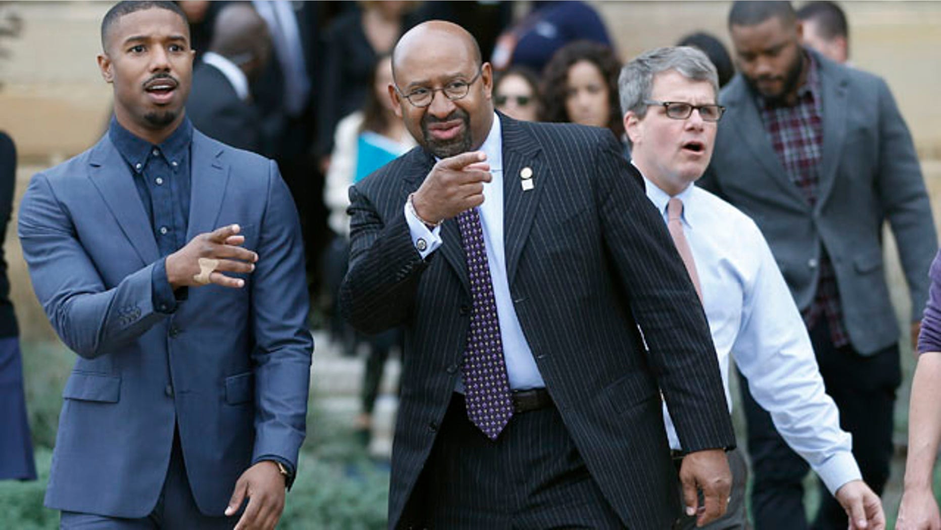 Nov. 6, 2015: Actor Michael B. Jordan, left, and Philadelphia Mayor Michael Nutter gesture as they walk to a press conference promoting the film 'Creed' outside the Philadelphia Museum of Art. (AP Photo/Matt Slocum)